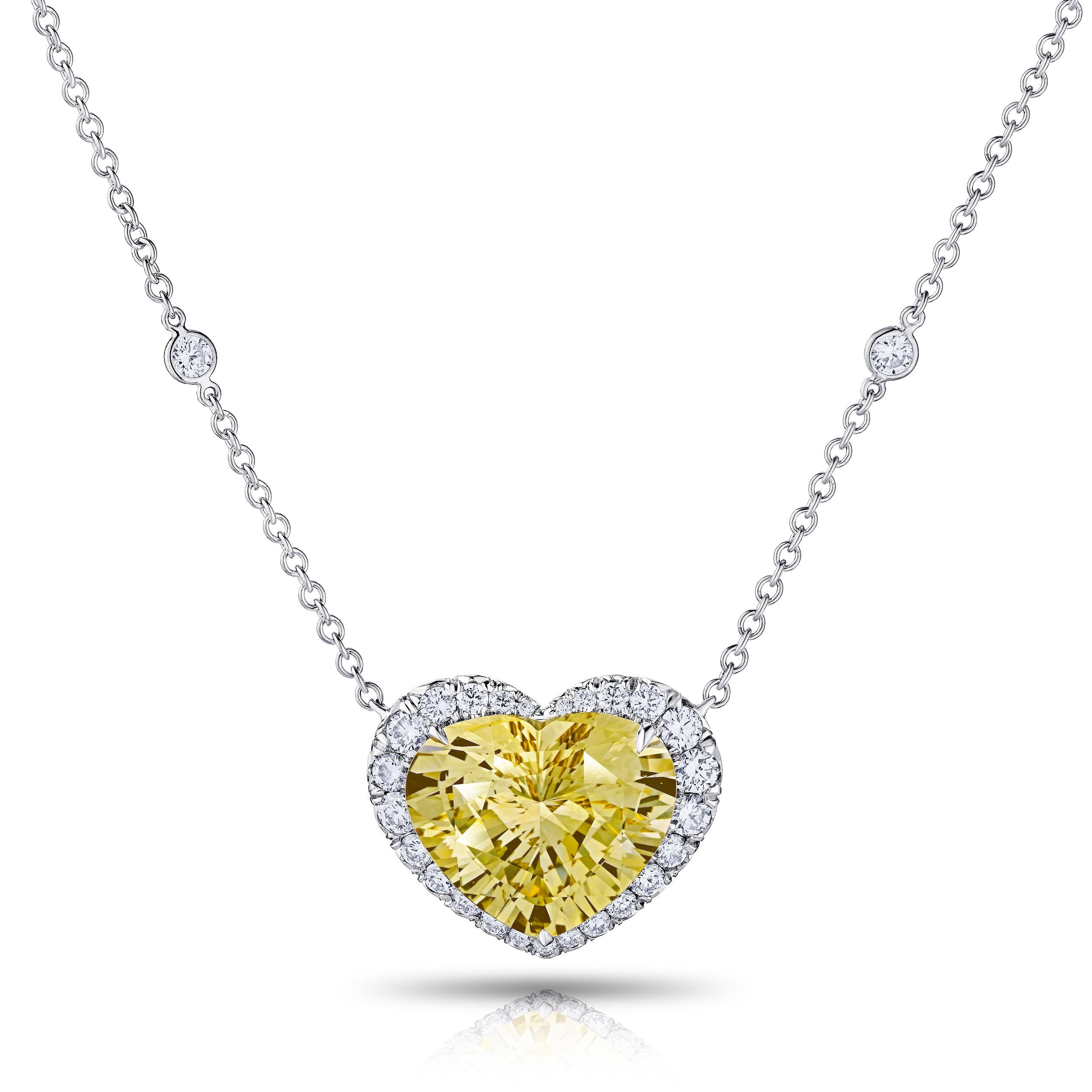 12.31 Carat Heart Shaped Yellow Sapphire NH with round brilliant cut diamonds 1.17 Carats set in handmade platinum pendant.