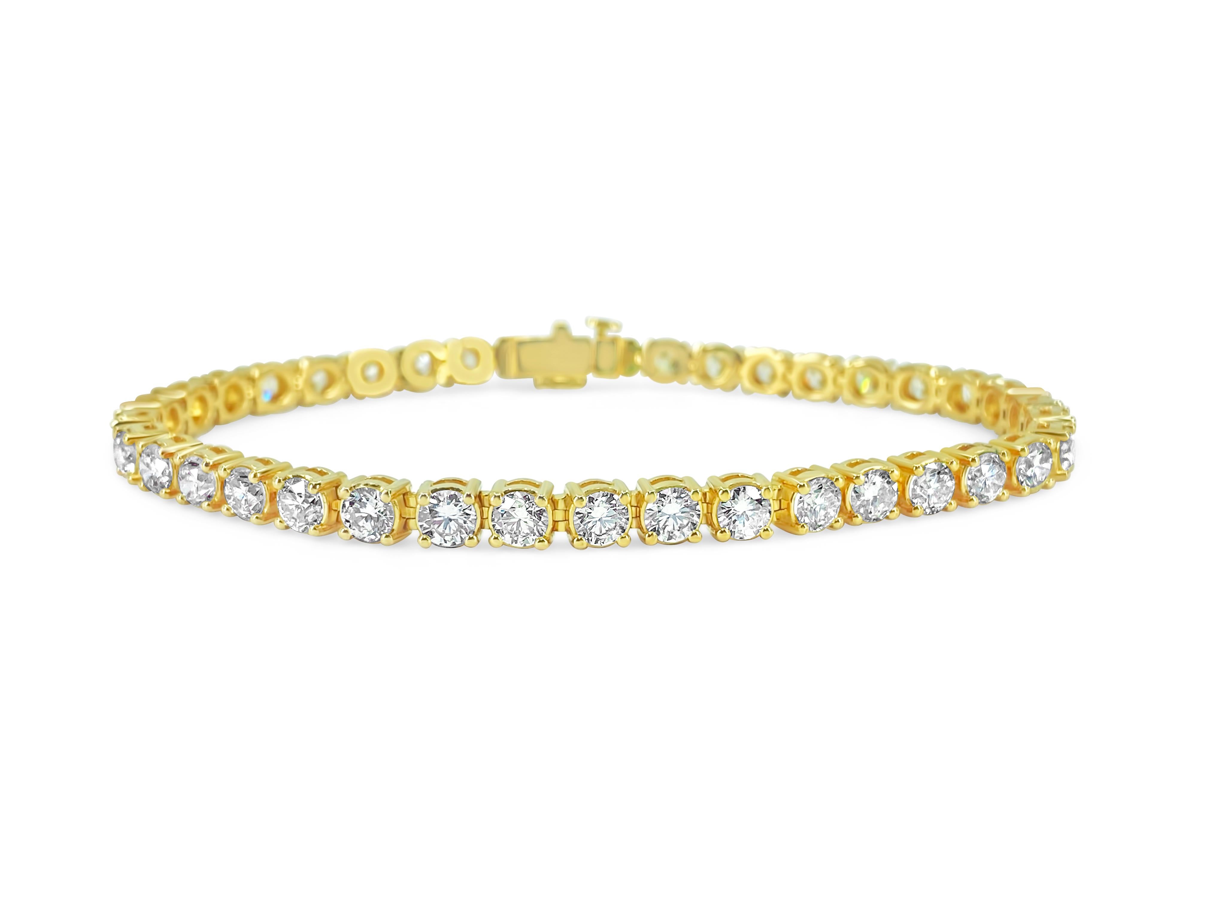 Elegance meets extravagance in this stunning 14k yellow gold diamond tennis bracelet, featuring 12.33 carats of dazzling round brilliant cut diamonds with VS clarity and G color. A masterpiece of natural earth-mined diamonds, this beautiful unisex