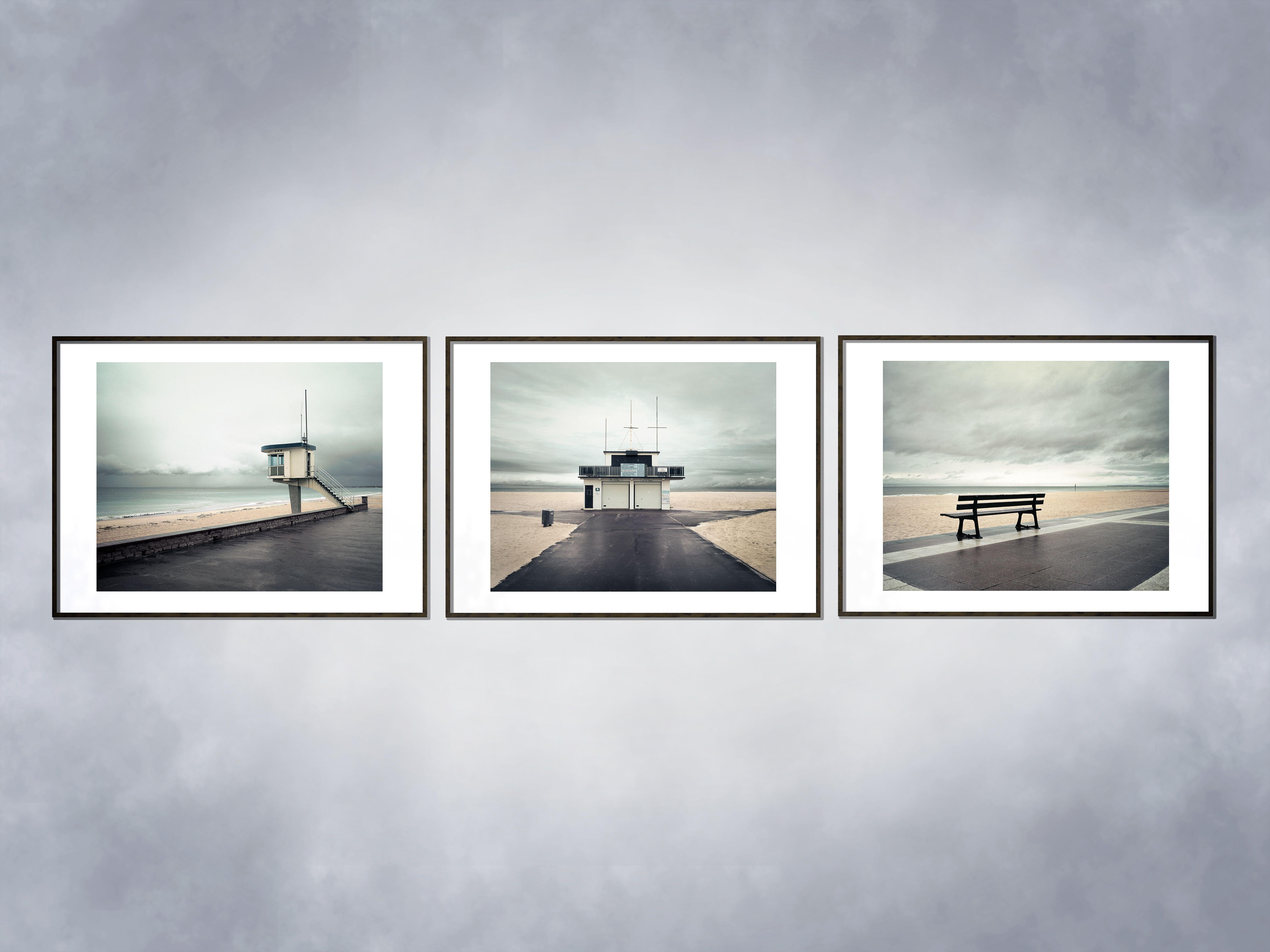Photograph of a bench at the coast of Normandy, France. Edition: 8 plus 2AP's. Photograph has a white border.  Printed on Hahnemule bright white paper. This photograph is one of a series of three called Sea day's. The price of the  triptych will be