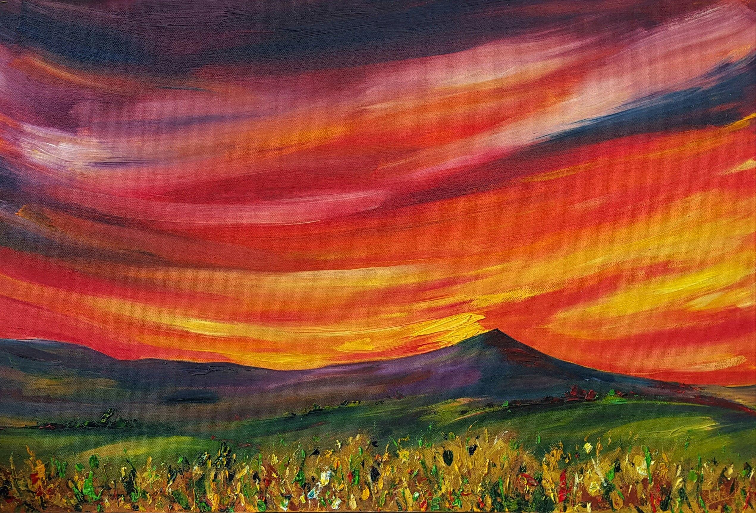 The Red red skies of Sunset is filled with the vivid colours of a vibrant sunset - it seemed like the whole sky was alight with flaming oranges and firey reds, making the landscape dramatic and epic..  The shape and slopes of Croghan Mountain on the