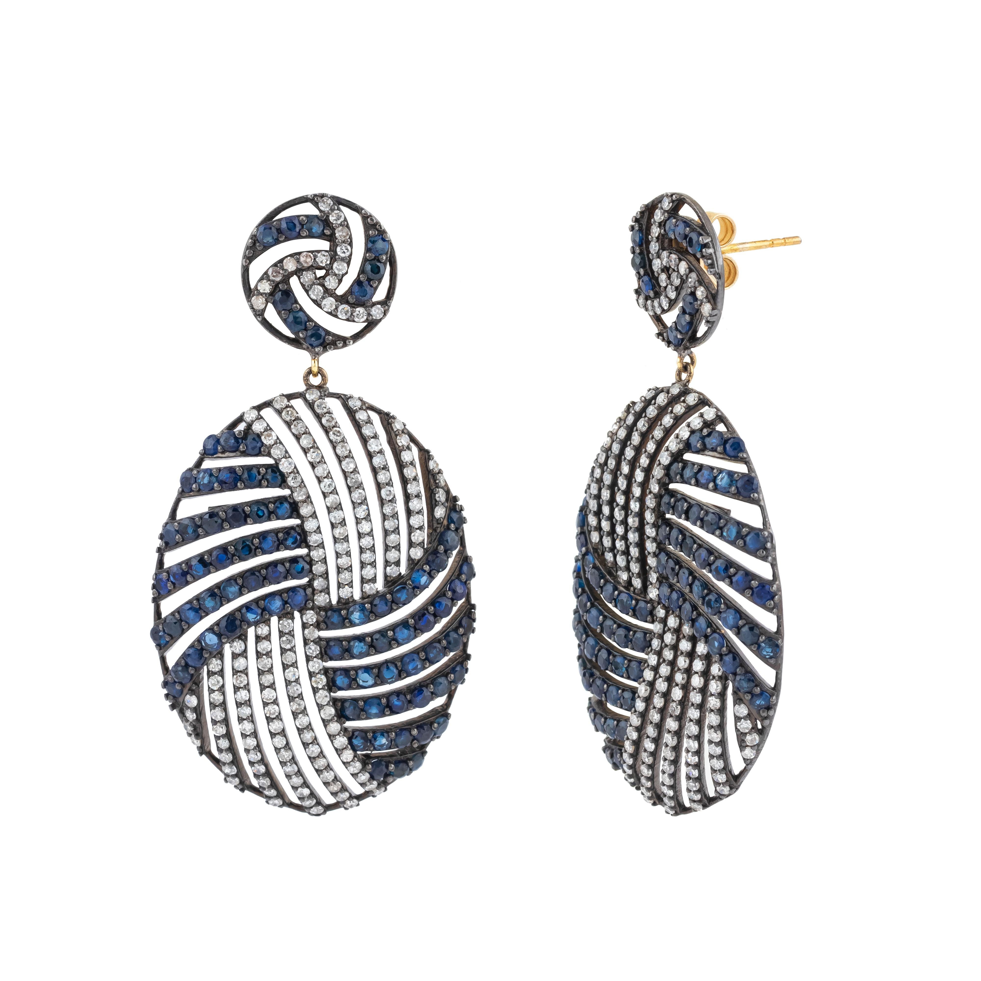 A masterpiece of timeless elegance, these 12.34 Carat Diamond and Color Stone Drop Earrings bring together an exquisite harmony of gemstones and intricate craftsmanship. Each earring is a work of art, featuring a perfectly cut diamond that captures