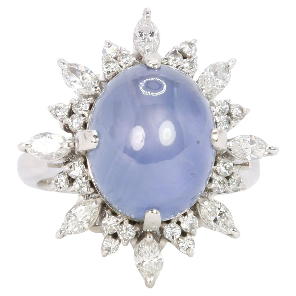 12.34 ct Ceylan Cabochon Star sapphire and diamond cluster ring For Sale