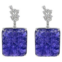 Orecchini in oro bianco con diamante tondo e tanzanite da 123,86 carati