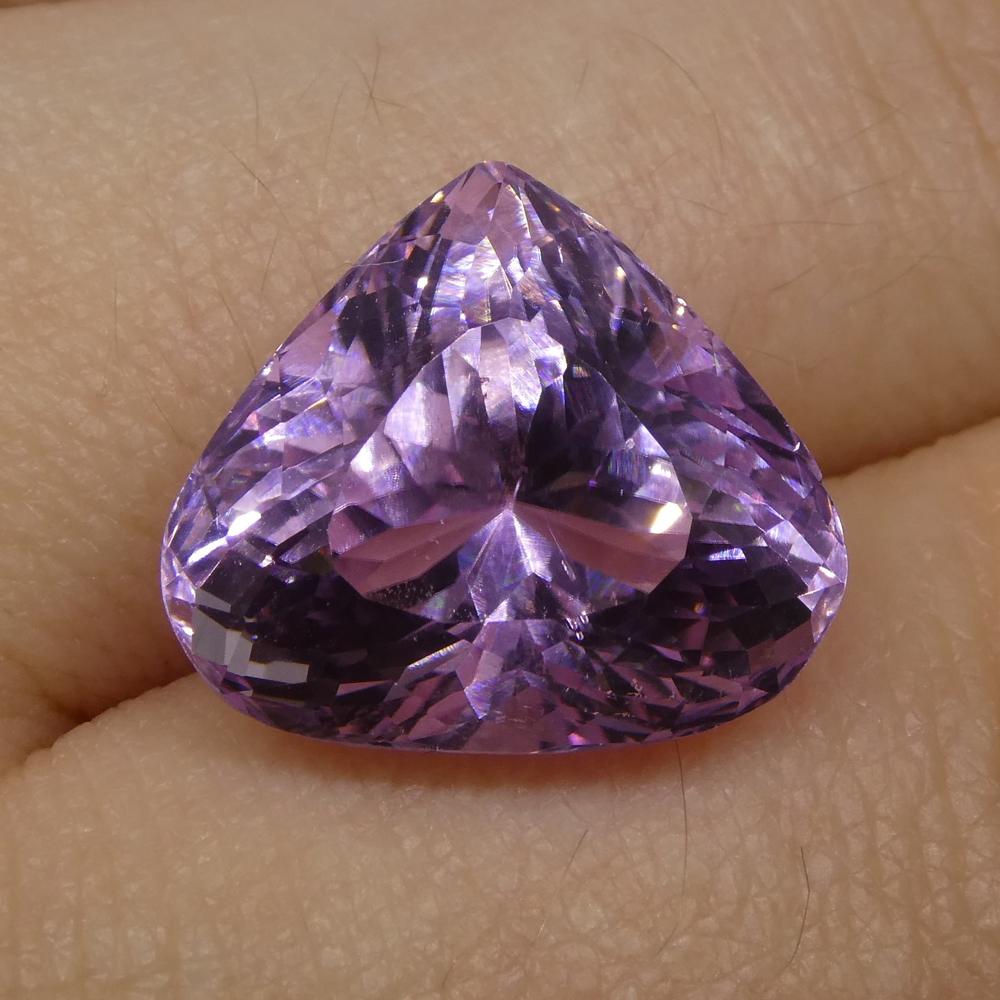 Description:

Gem Type: Kunzite
Number of Stones: 1
Weight: 12.39 cts
Measurements: 15.20x13.30x10.40mm
Shape: Pear
Cutting Style Crown: Modified Brilliant Cut
Cutting Style Pavilion: Mixed Cut
Transparency: Transparent
Clarity: Very Slightly