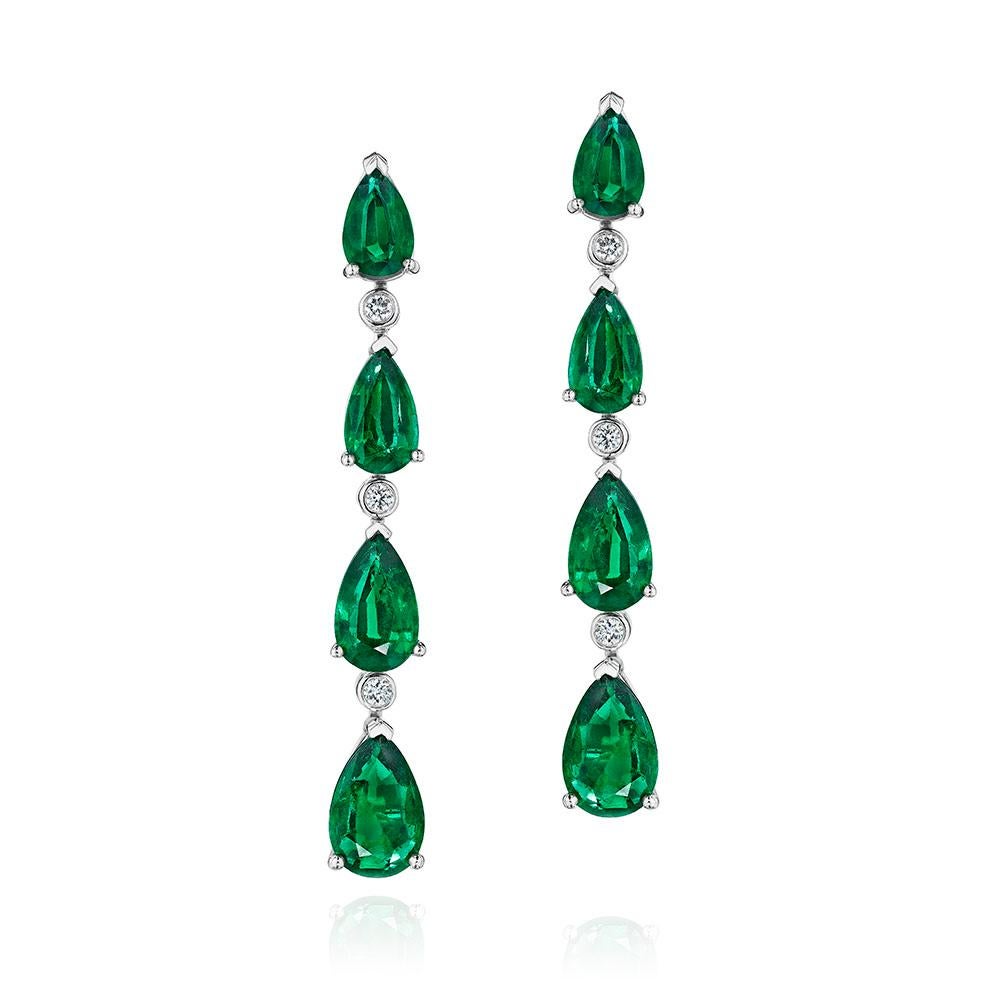 •	Platinum
•	12.39 Carats
•	Sold as pair

•	Number of pear Shape Emeralds: 8
•	Carat Weight: 12.19ctw

•	Number of Round Diamonds: 6
•	Carat Weight: 0.20ctw

•	This elegant pair of earrings features 8 pear shape green emeralds, set between 6 round