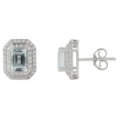 Boucles d'oreilles à double halo en or blanc 14 carats, avec une aigue-marine moderne de 1,23 ct et des diamants