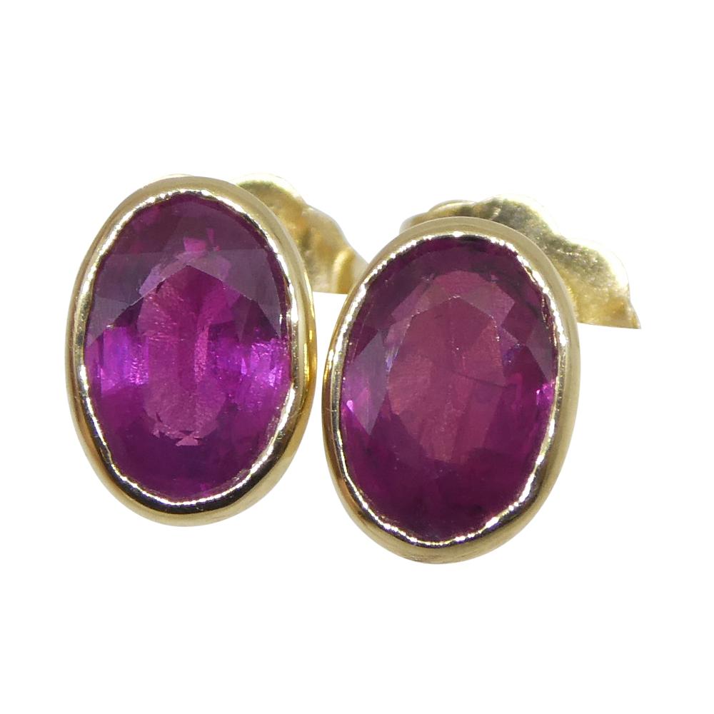 Women's or Men's 1.23ct Oval Red Ruby Stud Earrings set in 14k Yellow Gold For Sale