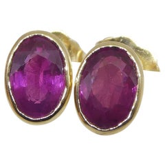 Boucles d'oreilles en or jaune 14k avec un rubis rouge ovale de 1.23ct