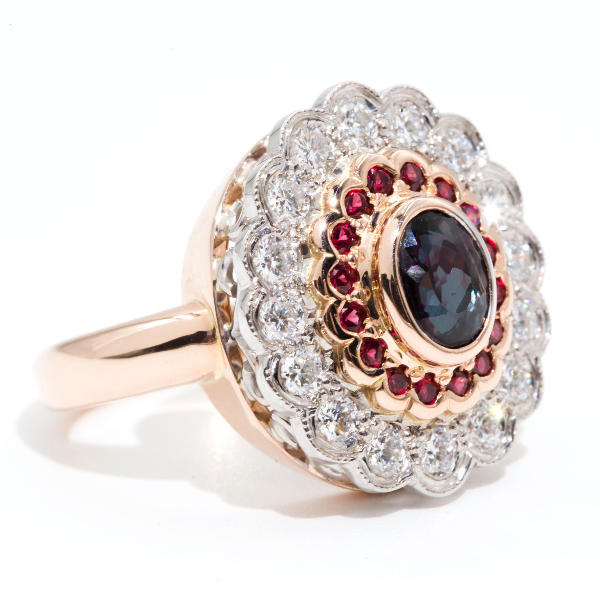Carefully handmade and crafted in 18 carat rose and white gold, this alluring one-of-a-kind halo cluster vintage ring features a stunning and rare 1.24 carat oval Alexandrite and is beset with a doubled scalloped border of sixteen bright red spinel