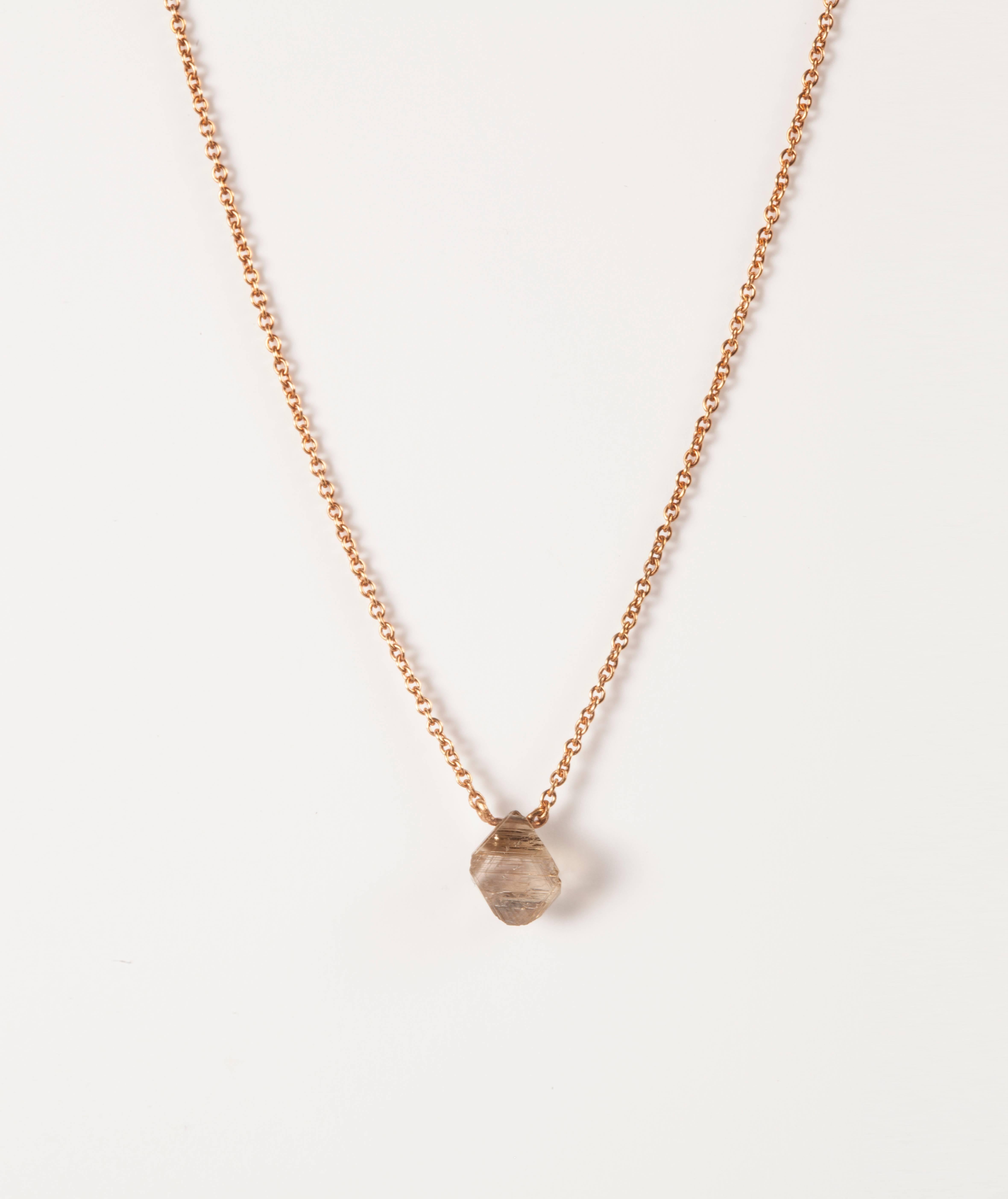 1.24 ct. Natural Light Brown Octahedron Rough diamond in 18K handcrafted rose gold necklace.

The necklace is 43,5 cm. but can be adjusted to fit. 

Origin of diamond: Australia

Every rough diamond from Roughdiamonds dk has been personally