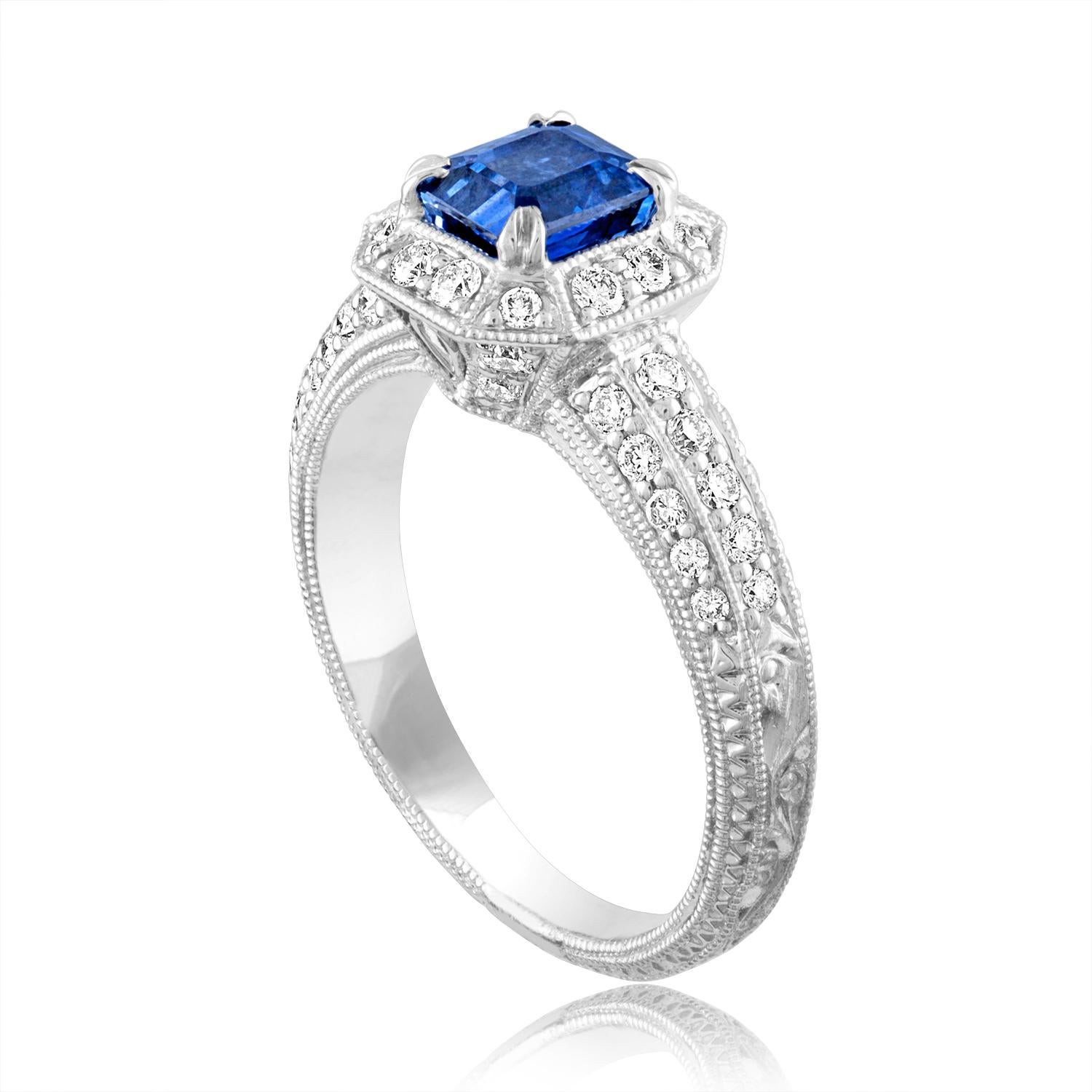 Beautiful Art Deco Revival Emerald Cut Milgrain Filigree Ring
The ring is 18K White Gold
The Center Stone is an Emerald Cut Blue Sapphire 1.24 Carats
The Sapphire is Heated
There are 0.60 Carats in Diamonds F/G VS/SI
The ring is a size 6.75,