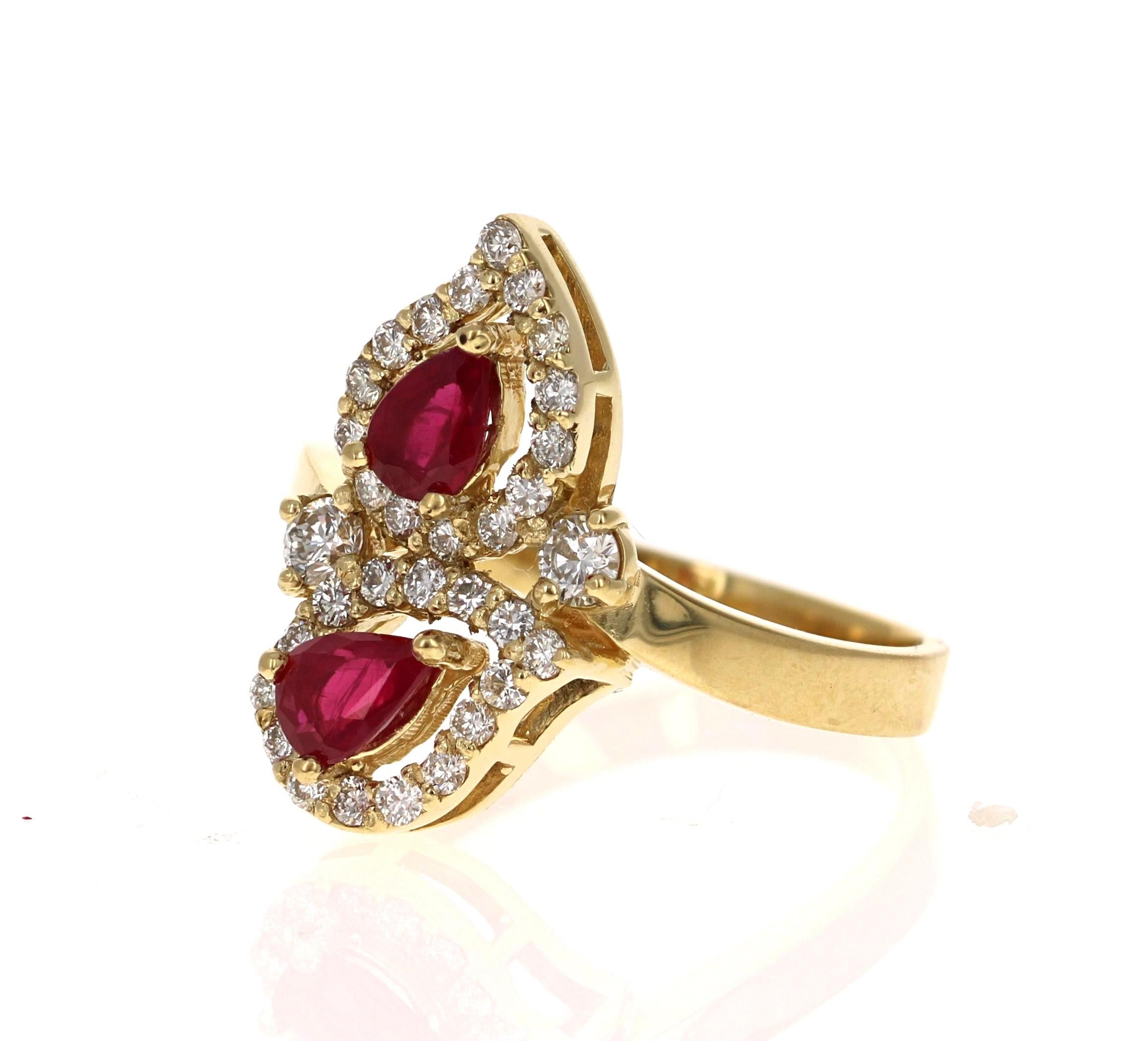 Simply beautiful Ruby Diamond Ring with 2 Pear Cut Burmese Rubies that weigh 0.73 Carats.   There are 32 Round Cut Diamonds that weigh 0.51 Carats. The total carat weight of the ring is 1.24 Carats. The clarity and color of the diamonds are VS2-H.