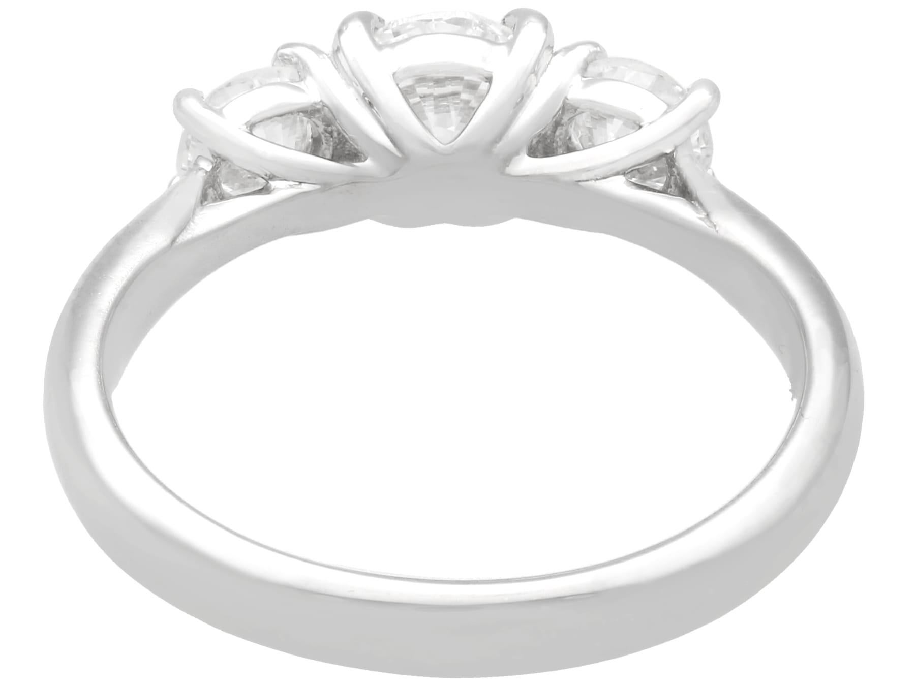 Round Cut 1.24 Carat Diamond and Platinum Three-Stone Engagement Ring For Sale