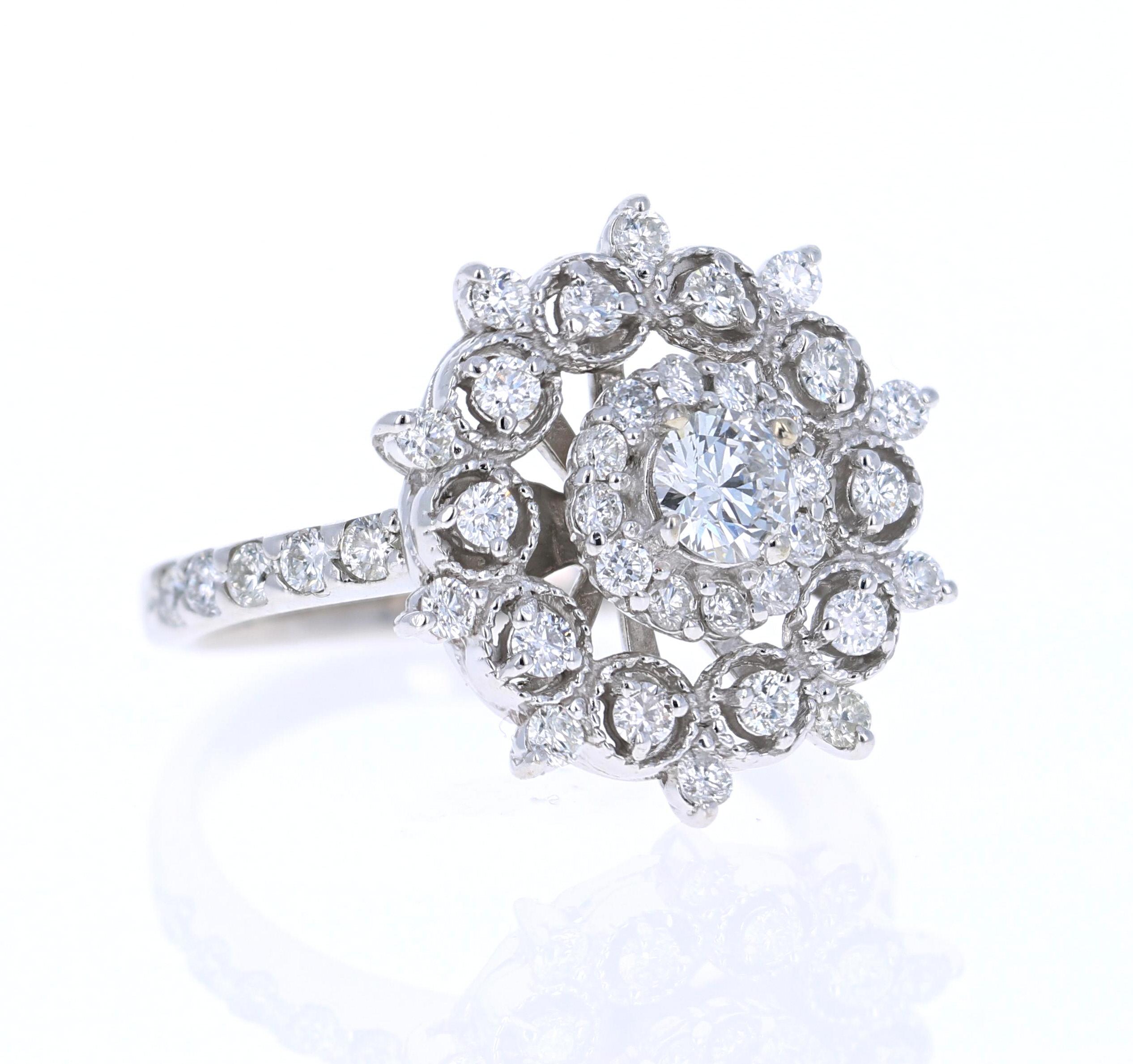 A truly unique designed cocktail ring - a statement piece that bejewels the entire finger!

This beautiful ring has a center diamond round cut diamond that weighs 0.30 carats with a clarity of SI and color of F. It also has 42 round cut diamonds