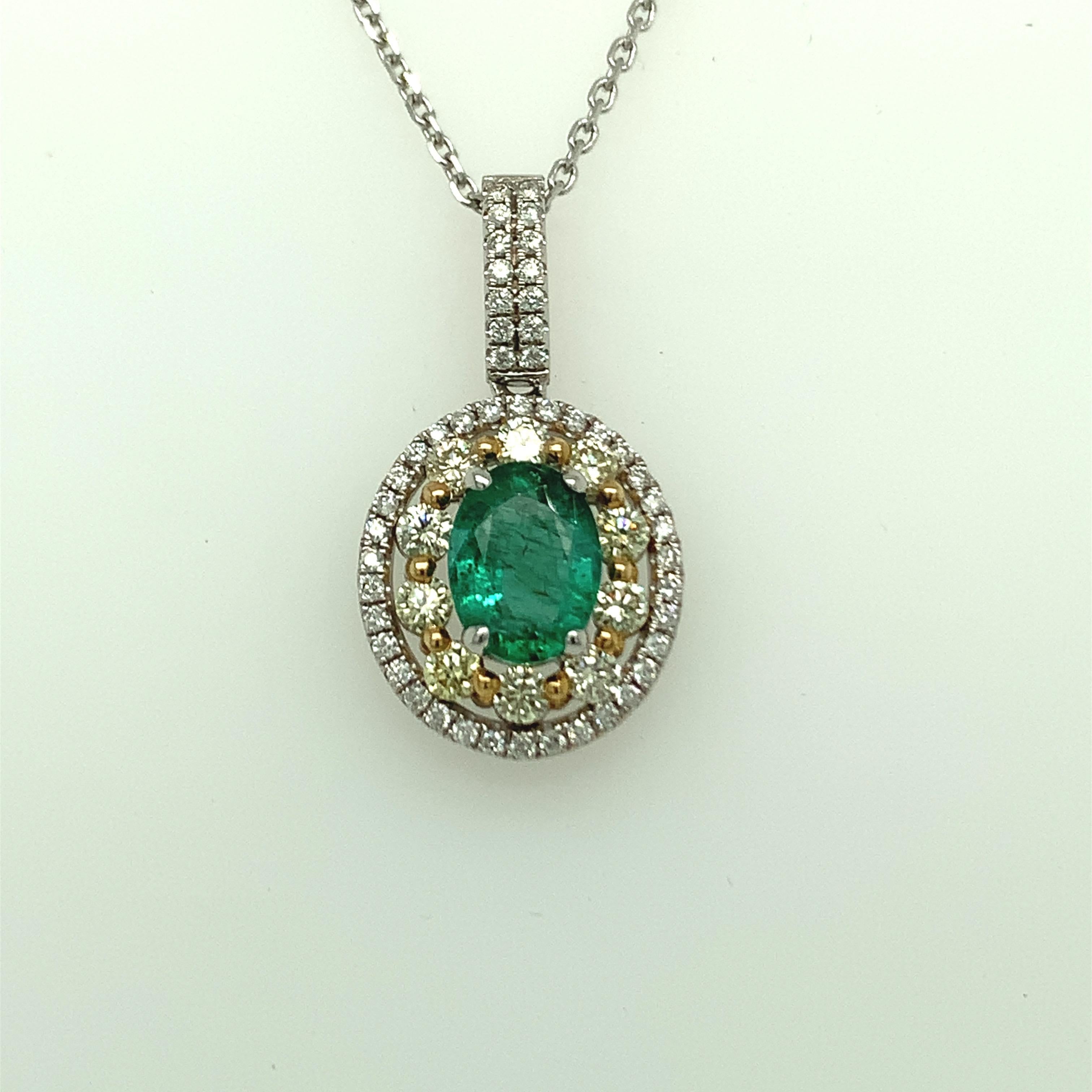 Oval emerald has double halo of yellow and white diamonds. Double halo makes the center stone stand out and look bigger. Set in two tone gold, a white gold chain is included. Crafted with hand.
Emerald: 1.24ct
White Diamond: 0.22ct
Yellow Diamond: