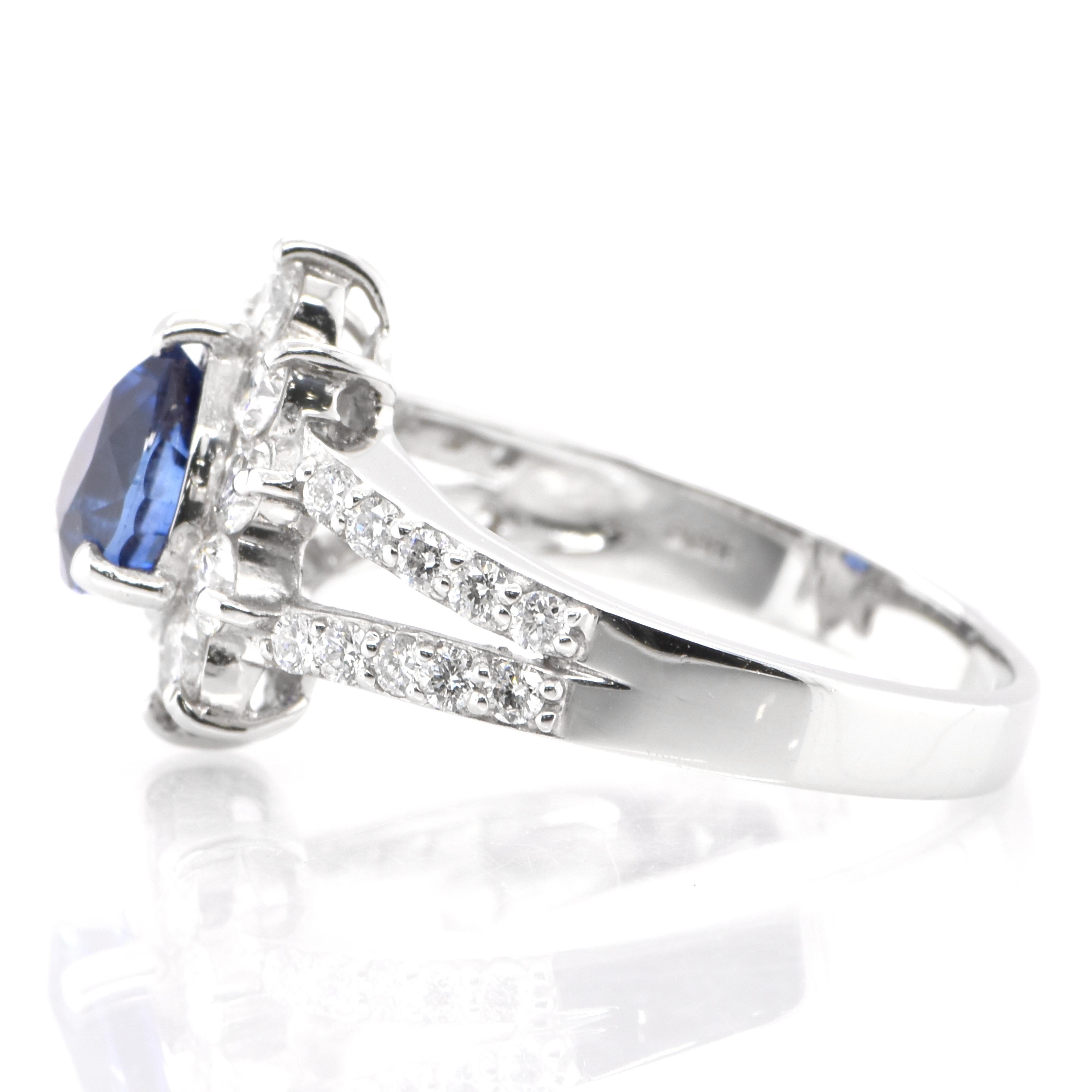 Pear Cut 1.24 Carat Natural Blue Sapphire and Diamond Ring Set in Platinum For Sale