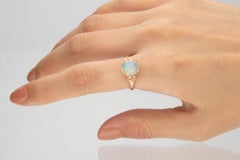 1.24 Carat Opal Oval Cab and Diamond 10K Rose Gold Classic Ring
