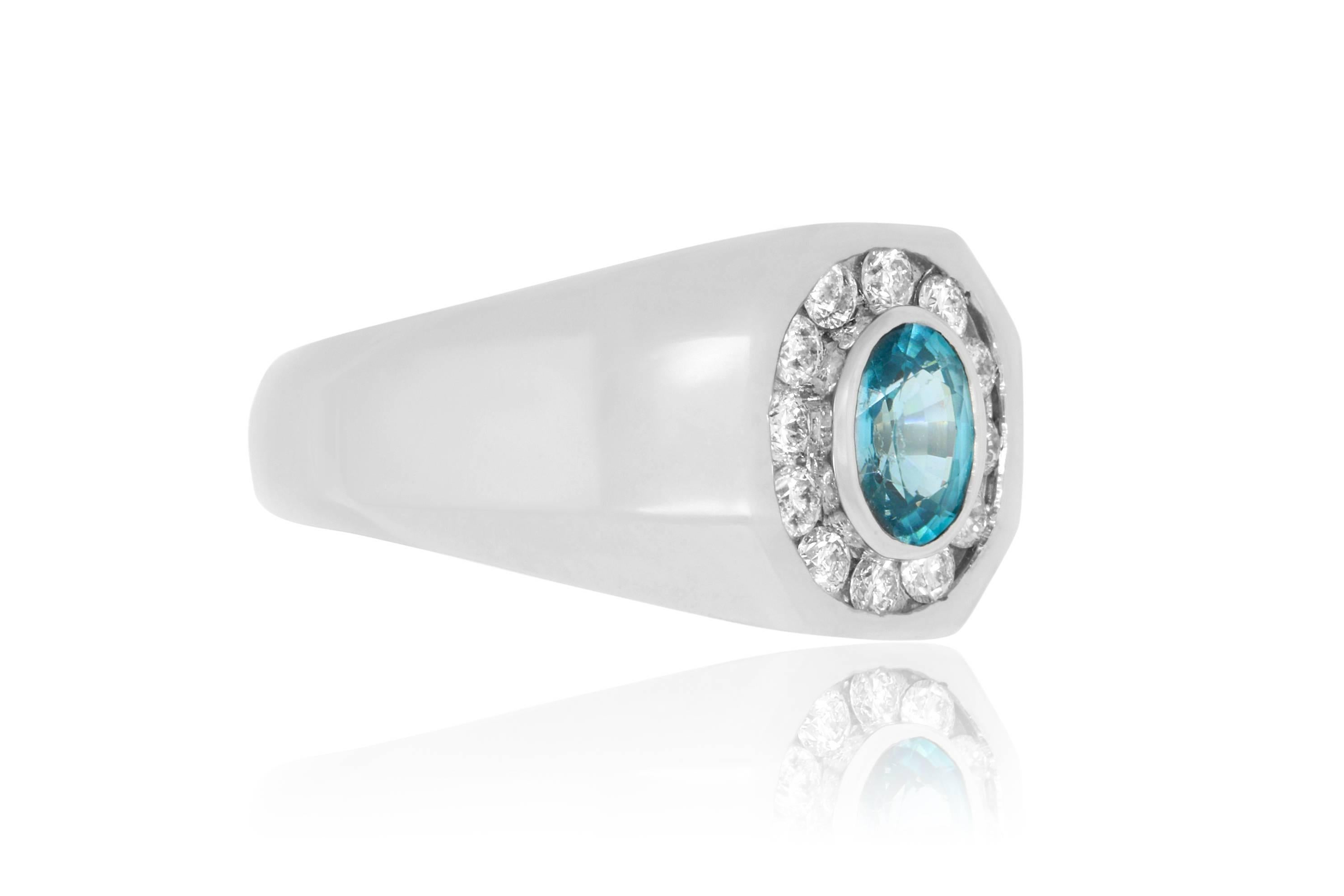 A birthstone for December!

Material: 14k White Gold
Colored Diamond:: 1 Oval Blue Zircon at 1.24 carats.
Diamonds: 12 Round White Diamonds at 0.50 carats. SI Clarity / H-I Color. 
Ring Size: 10. Alberto offers complimentary sizing on all