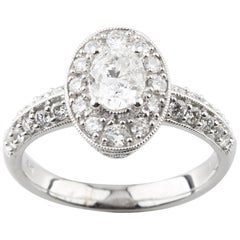 1.24 Carat Oval Diamond 18 Karat White Gold Engagement Ring Accents