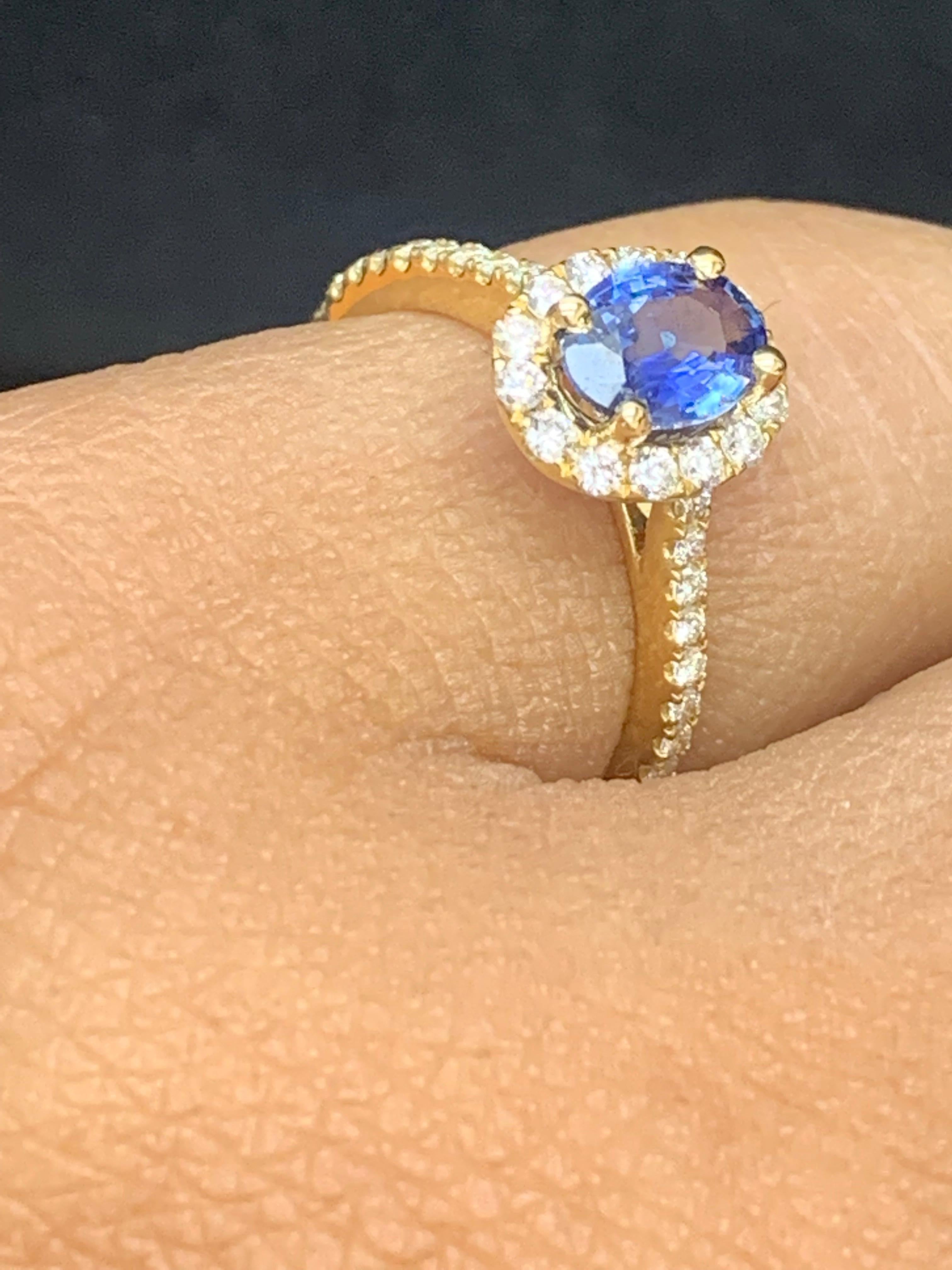 Modern 1.24 Carat Oval Sapphire and Diamond Halo Engagement Ring in 18K Yellow Gold For Sale