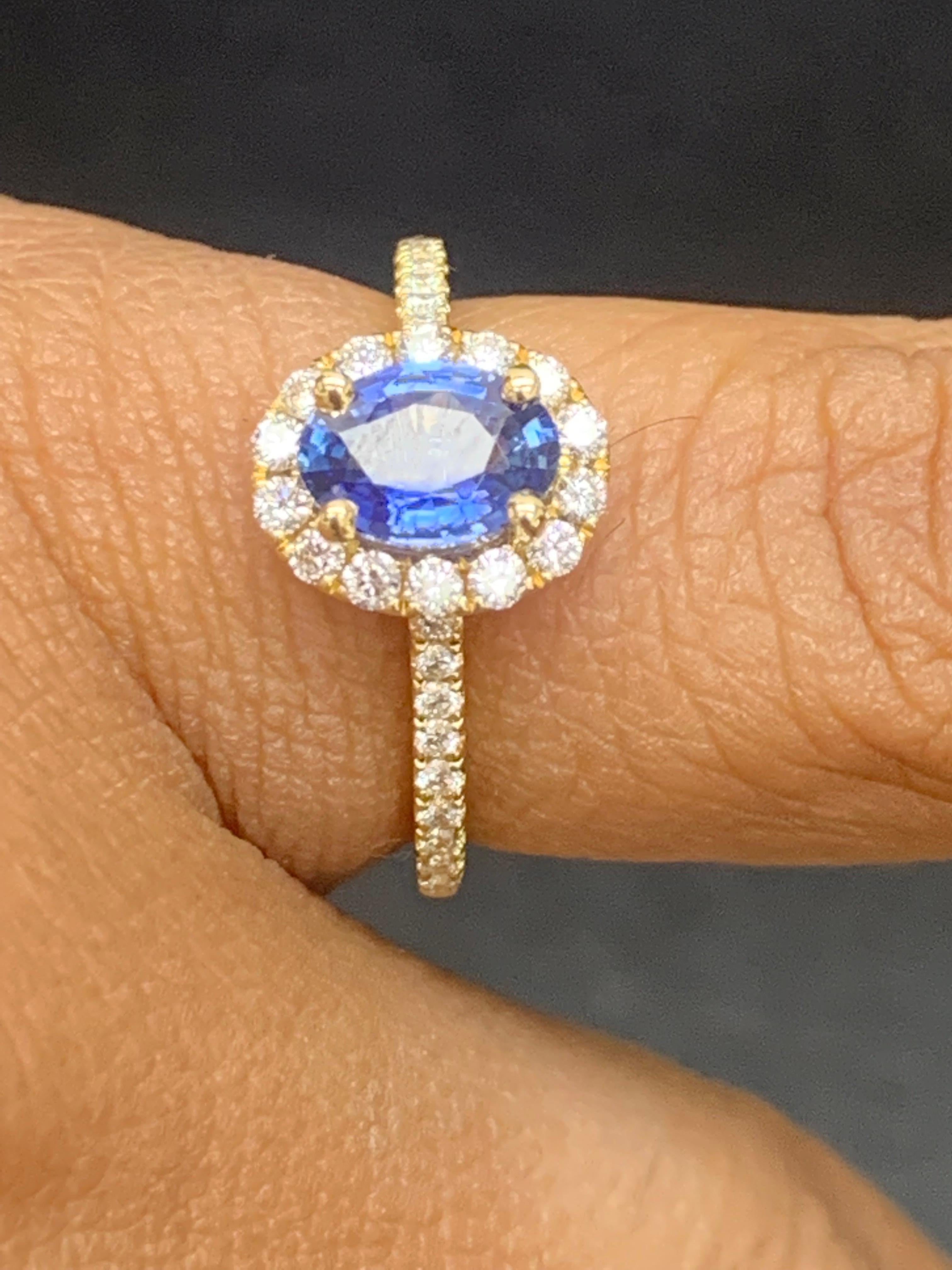 Women's 1.24 Carat Oval Sapphire and Diamond Halo Engagement Ring in 18K Yellow Gold For Sale
