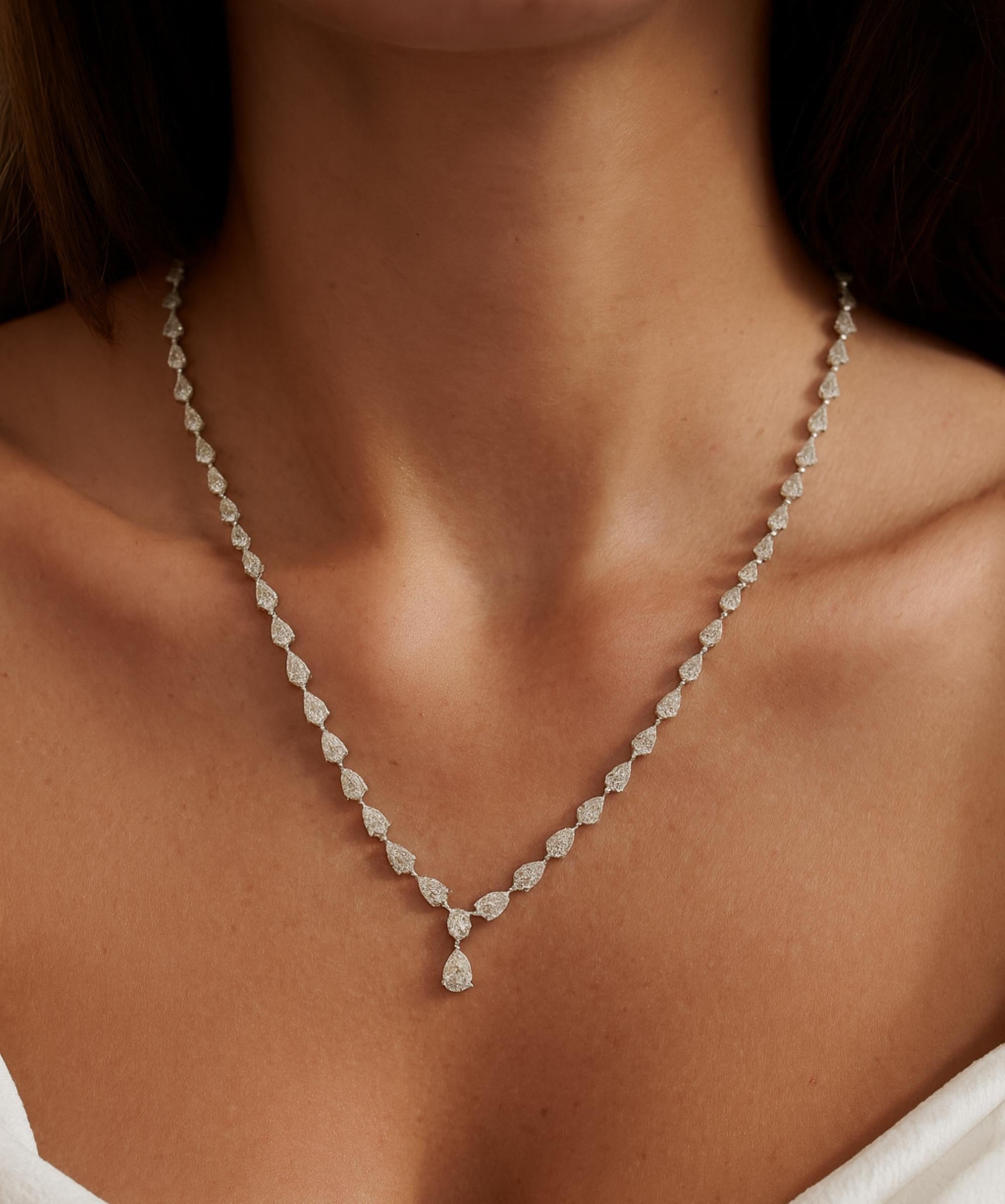 12.4 Carat Pear Cut Diamond Drop Necklace 18 Karat White Gold Handmade Jewelry 
The design features a continuous line of pear-cut diamonds. The necklace culminates in a single pear-cut diamond drop pendant.
Diamonds are a universal symbol of