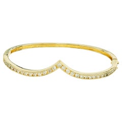 Armreif aus 14 Karat Gelbgold mit 1,24 Karat rundem Diamanten im Brillantschliff