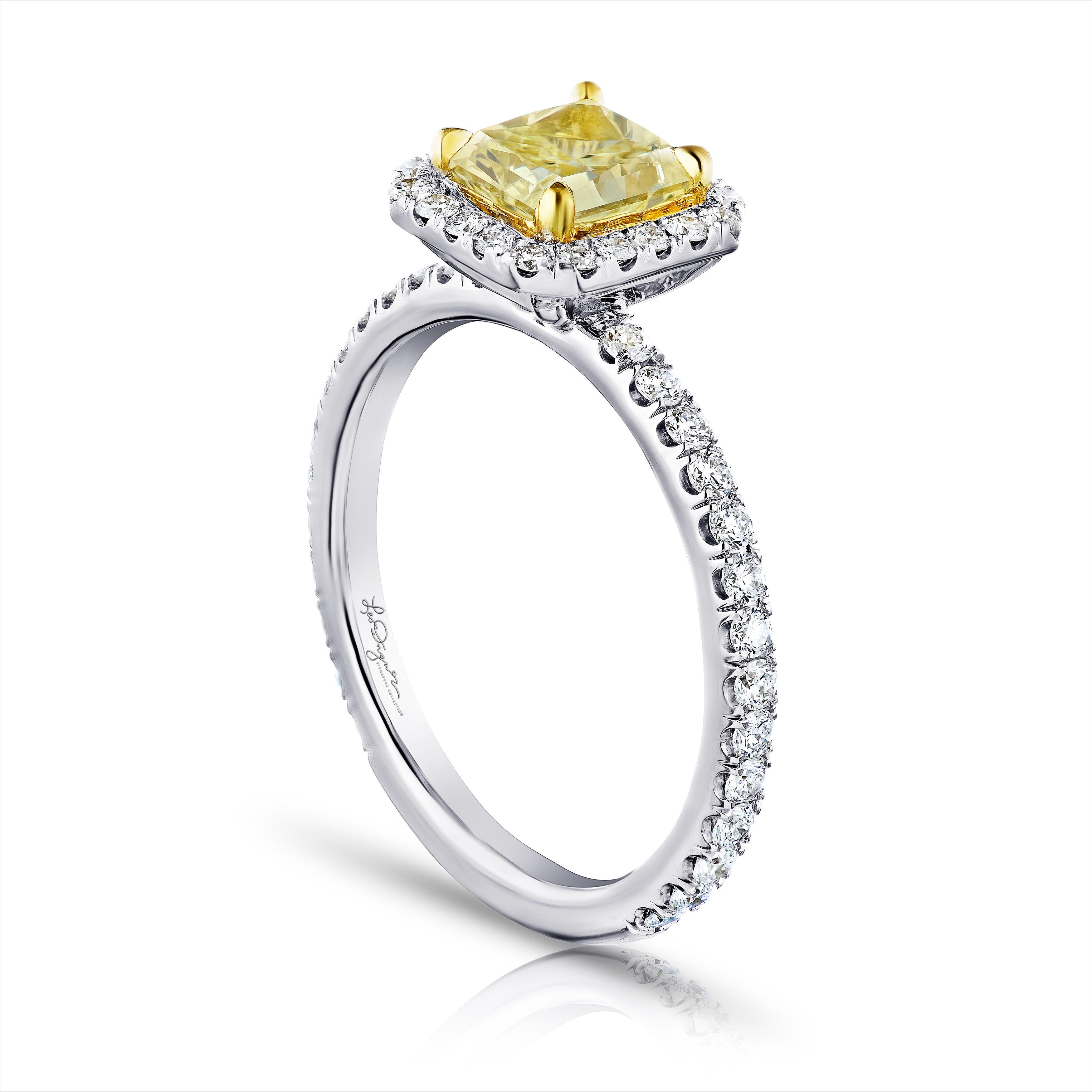 Stunning Yellow Radiant Cut 1.24 ct. GIA Certified W-X color SI2 set in a 18kt yellow cup to give this beauty the boost it needs to compete with those Fancy intense yellows but a a much nicer price! This classic halo contains .58 ct. total weight of