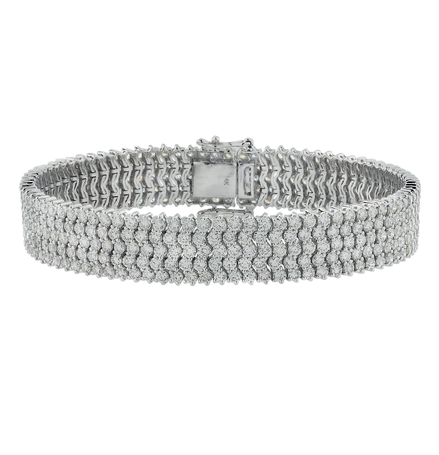 Luxurious five row diamond bracelet, crafted in white gold, featuring 414 round brilliant cut diamonds weighing approximately 12.40 carats total, G-H color, VS-SI clarity. The diamonds are set in waves flowing around the wrist in a sea of eternity,