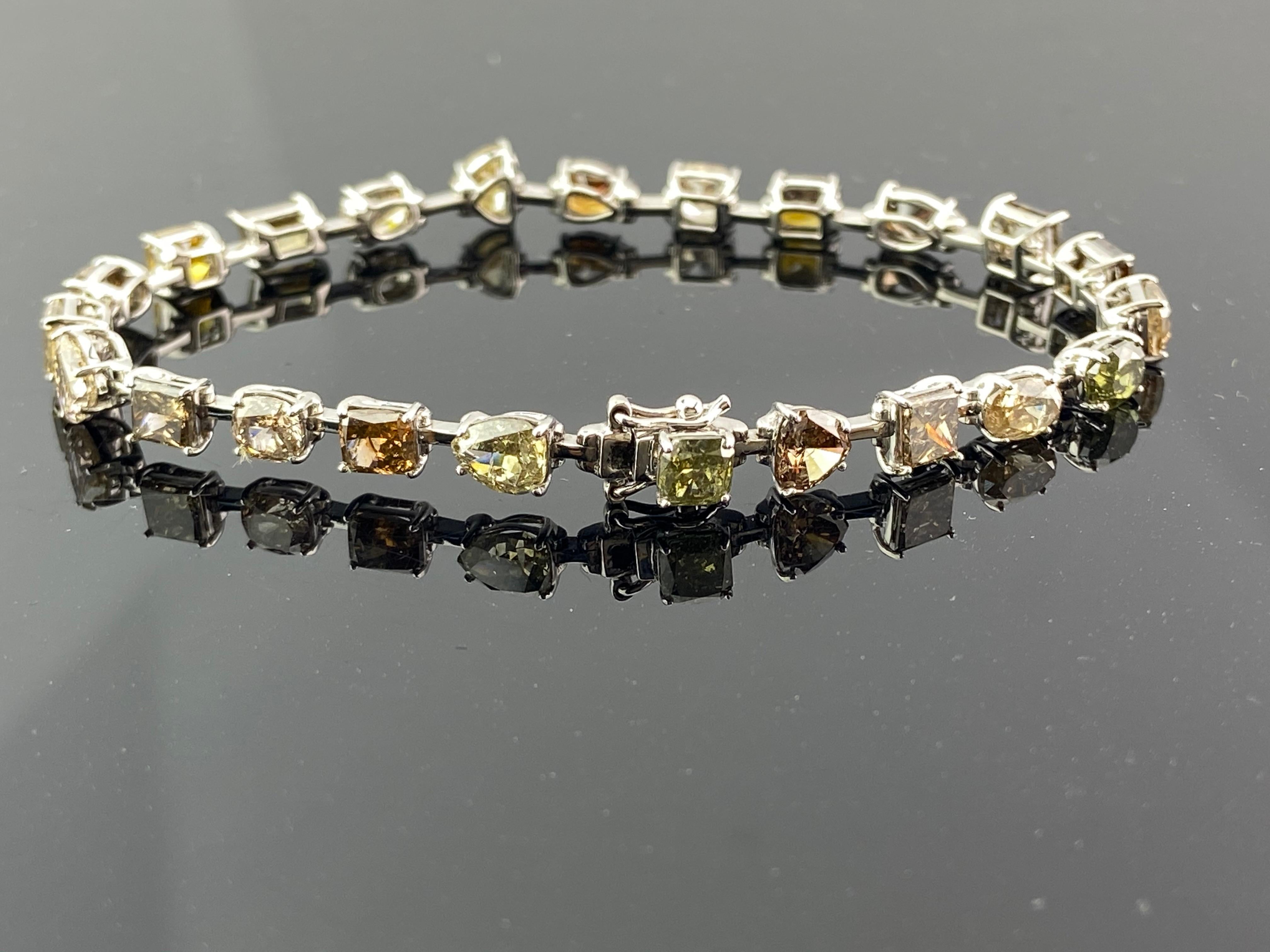 A unique, 12.40 carat Coloured Diamonds tennis bracelet, featuring 23 pieces of SI quality Diamonds, set in 10.52 grams of solid 18K White Gold. The bracelet is 7 inces long, and weighs around 13.5 grams in total.
Returns accepted within 7 days of