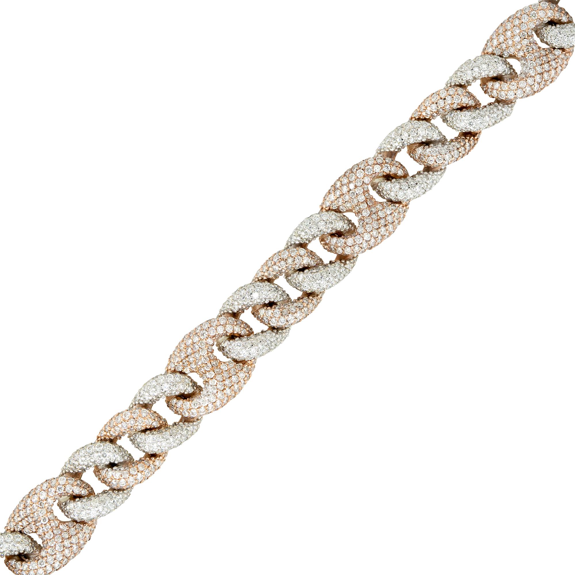 This 12.40 carat pave diamond link bracelet features a classic Cuban link design as well as a Mariner Link chain. The chain has thick, flat, interlocking links that create a bold and substantial look. The bracelet is made of high-quality 14k white