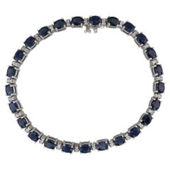 Bracciale tennis con diamanti e zaffiro blu da 12,40 ctw in oro bianco 14k 6,75" 4,7mm