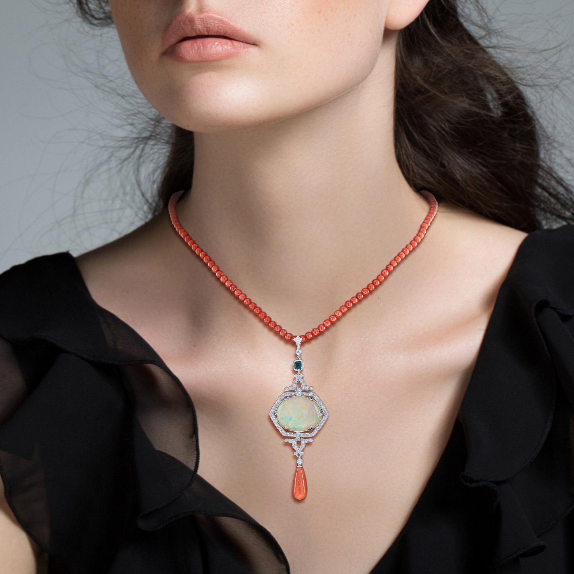 A significant, irregularly cut, oval Ethiopian opal exhibiting a blue, green, yellow, and orange color palette is ensconced in this fabulous and versatile pendant necklace. An elegance frame surround the opal is decorated with total of 12.42 carat