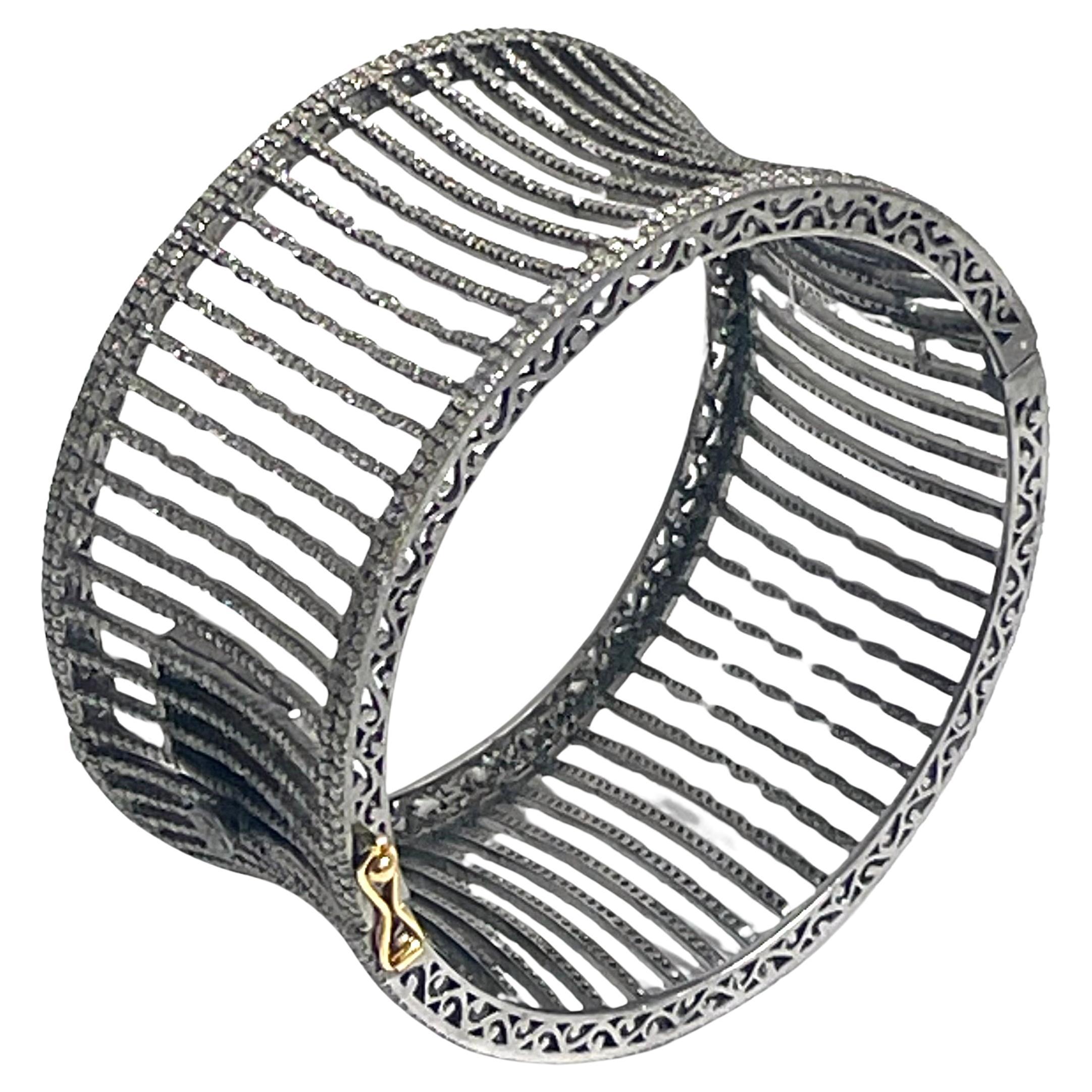 Description
This bracelet screams “I’m enough!” Make a grand entrance and turn heads with this exceptionally stunning statement diamond cuff bracelet. Beautifully designed concave diamond bars are what makes this wide cuff bracelet untraditional and