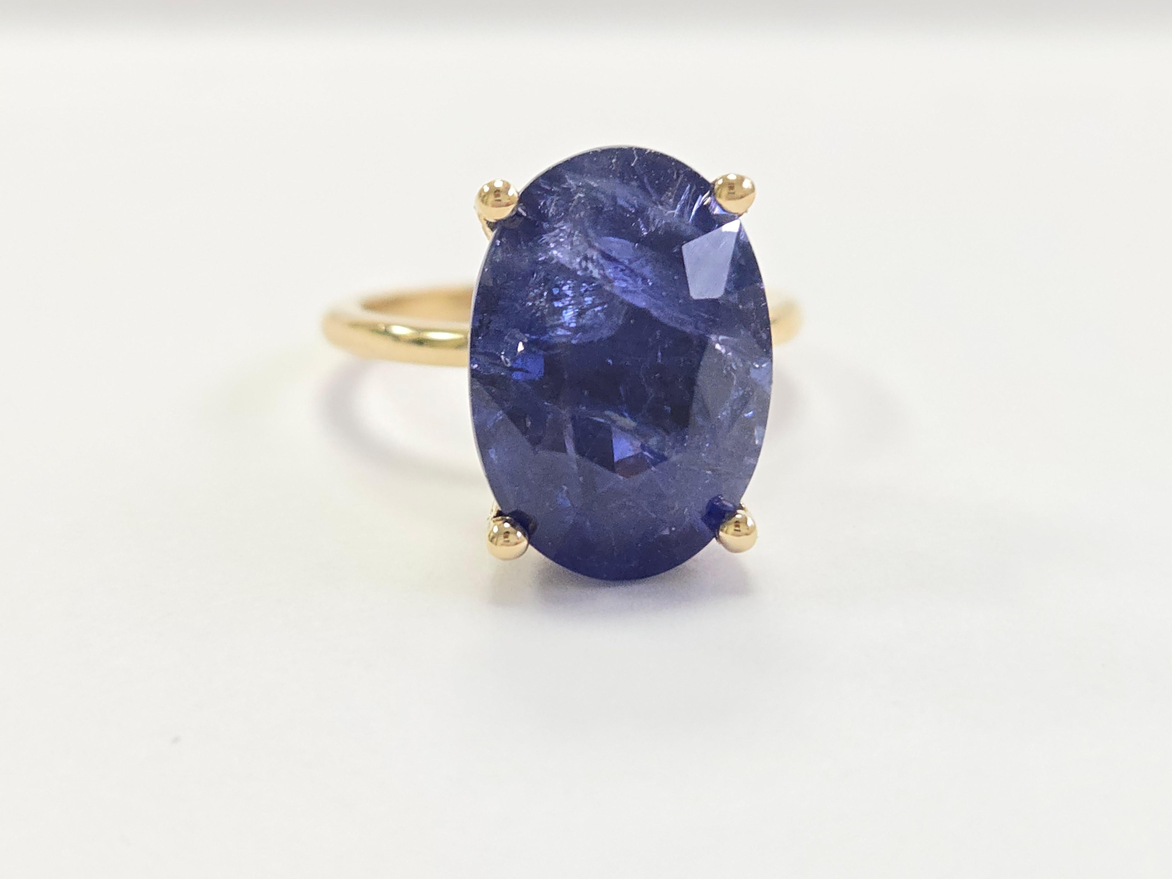 12.45 Carat Oval Shape Natural Sapphire Ring in 14 Karat Yellow Gold

This exquisite ring features a brilliant 12.45-carat natural sapphire, cut into a perfect oval shape, set in a luxurious 14-karat yellow gold band. The sapphire's rich color and