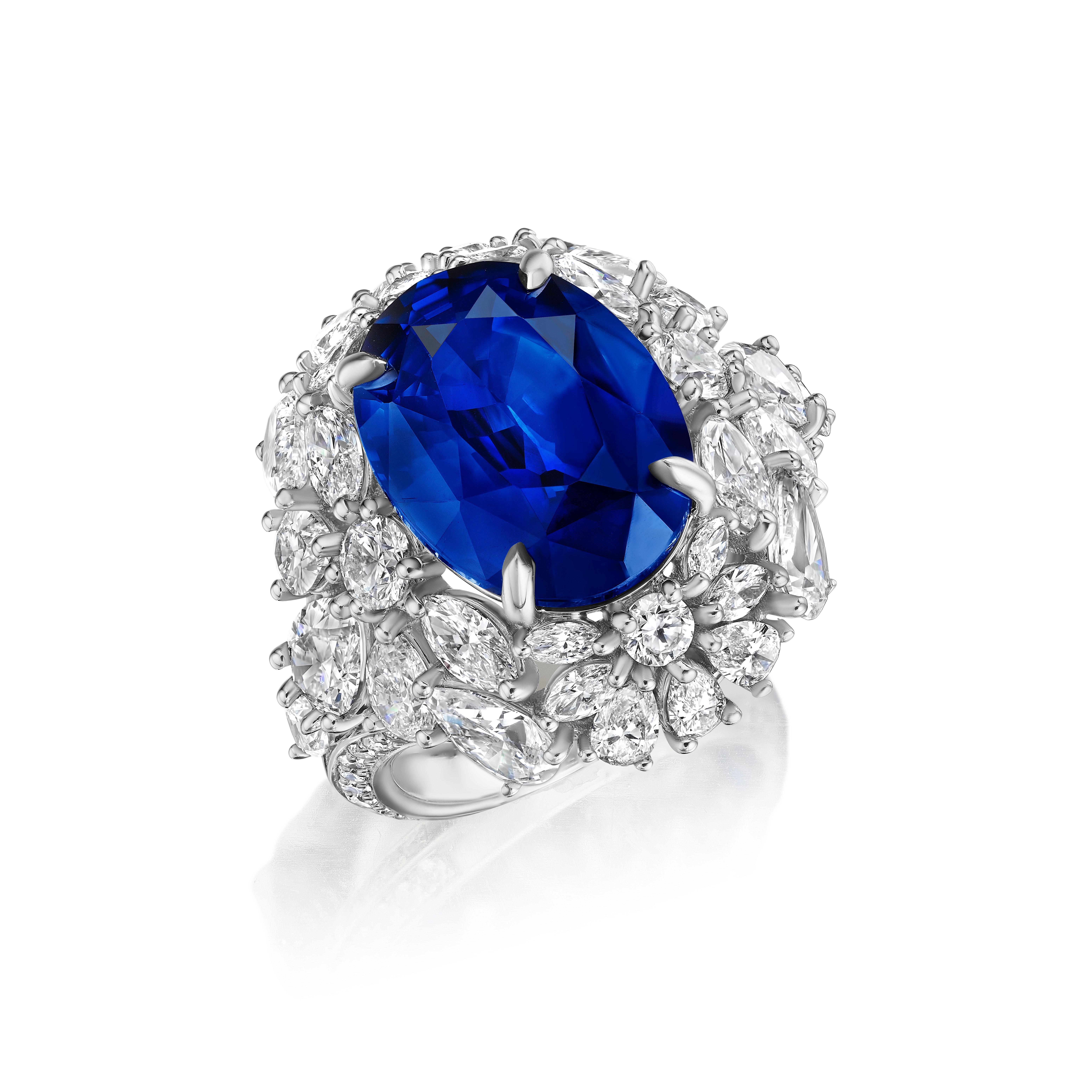 •	12.46 Carats
•	Platinum
•	Size: 6.5

•	Number of Oval Sapphires: 1
•	Carat Weight: 7.89ctw
•	Origin: Sri Lanka
•	Color: Vivid Blue – Royal Blue
•	Stone Measurements: 13.85 x 10.47mm

•	Number of Pear Shape Diamonds: 18
•	Carat Weight: