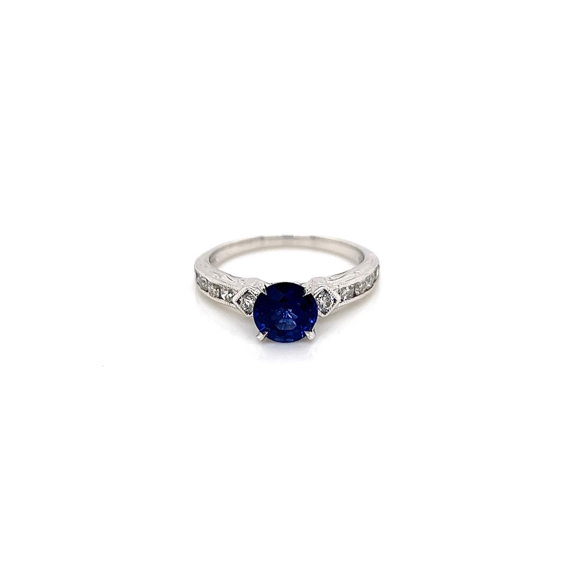 1.24 Total Carat Sapphire Diamond Engagement Ring

-Metal Type: 18K White Gold
-0.99 Carat Round Cut Blue Sapphire
-0.25 Carat Round Side Diamonds 
-Size 4.75

Made in New York City