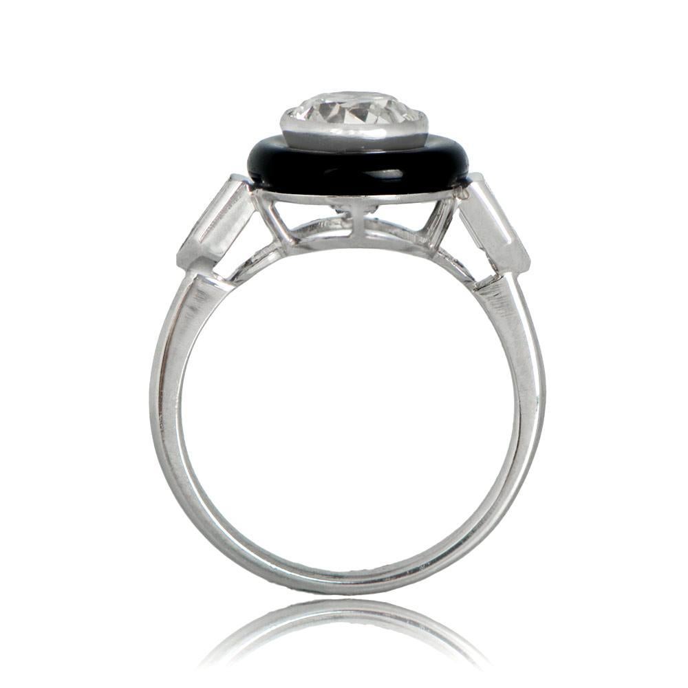 An Art Deco inspired ring with natural onyx and bullet-cut diamonds accenting the center old European cut diamond. The diamond is J color, VS2 clarity, and approximately 1.24 carats, while the bullets weigh 0.41 carats total. The openwork filigree