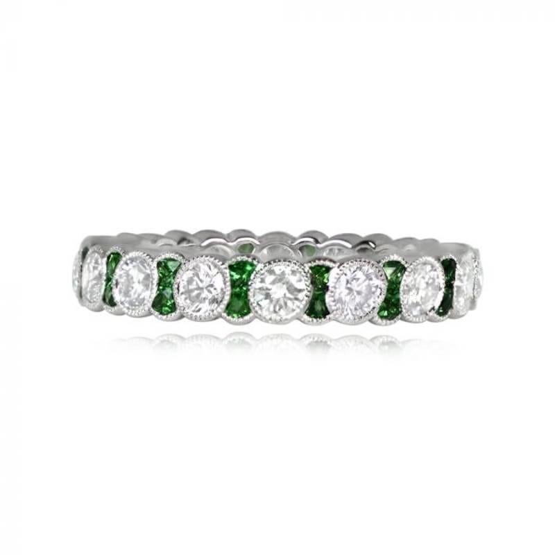 A stunning eternity band with round brilliant cut diamonds and French cut Tsavorite Garnets, bezel-set with fine milgrain detailing. Handcrafted in platinum, the total diamond weight is 1.24 carats. The band has a width of 3.30mm.

Ring Size: 6.25