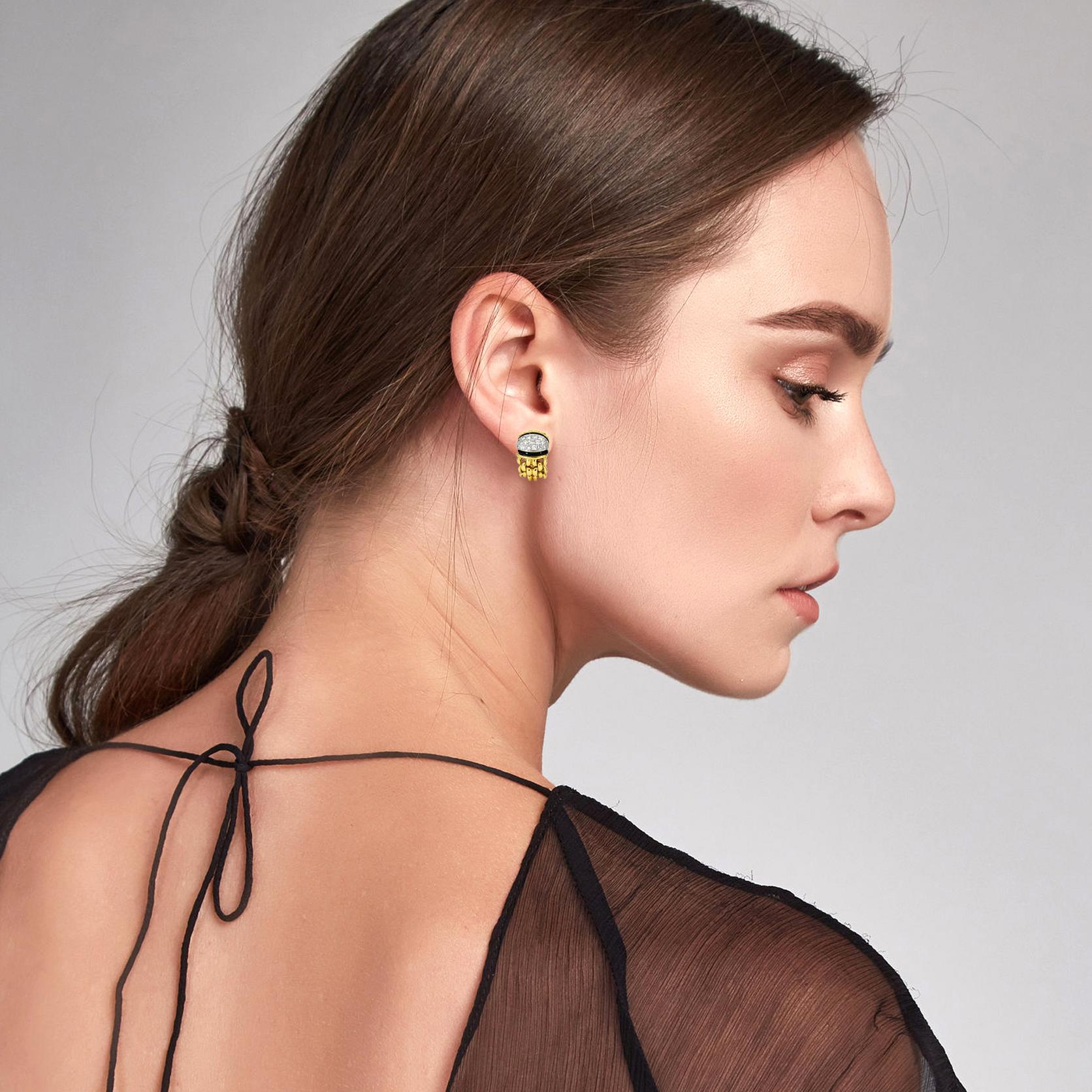 Diamond and onyx earrings crafted in 18-karat yellow gold. The earrings have 38 round-cut diamonds and black onyx gemstones. Heavy chain design half hoop earrings with omega backs. 

Size, Medium
Height, 21mm
Width, 13.5mm
Depth, 6.6mm
Weight, 24.2