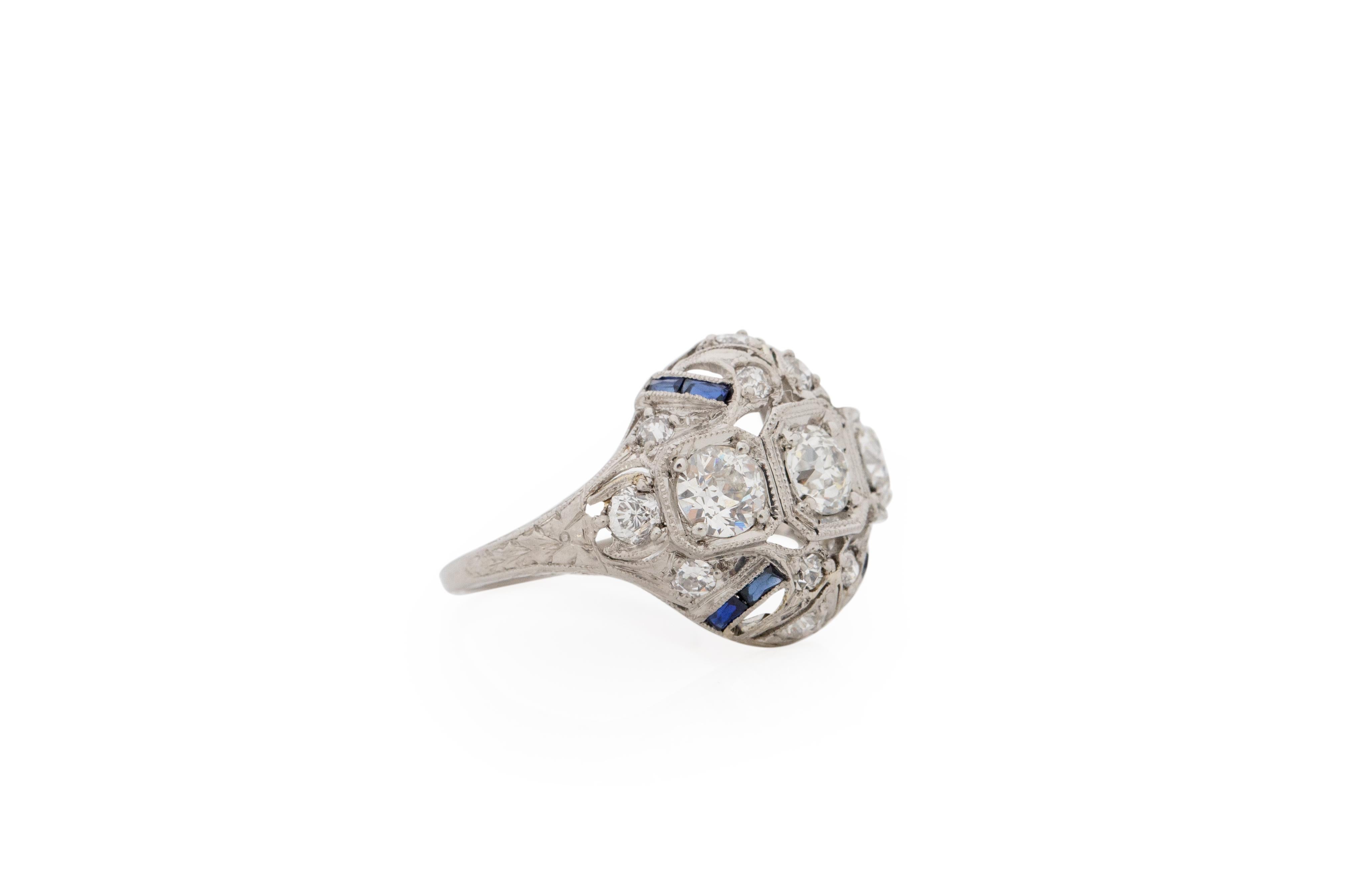 Item Details: 
Ring Size: 5
Metal Type: Platinum [Hallmarked, and Tested]
Weight: 4.2 grams

Diamond Details:
Weight: 1.25 carat, total weight
Cut: Old European brilliant
Color: G-H
Clarity: VS

Sapphire Details:
French Cut, .25 carat total weight,