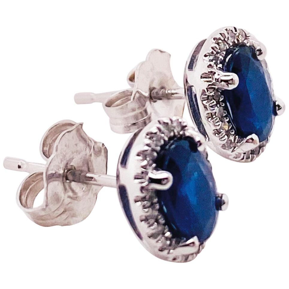 1.25 Carat Blue Sapphire and Diamond Halo Oval Earring Studs in 14 Karat Gold