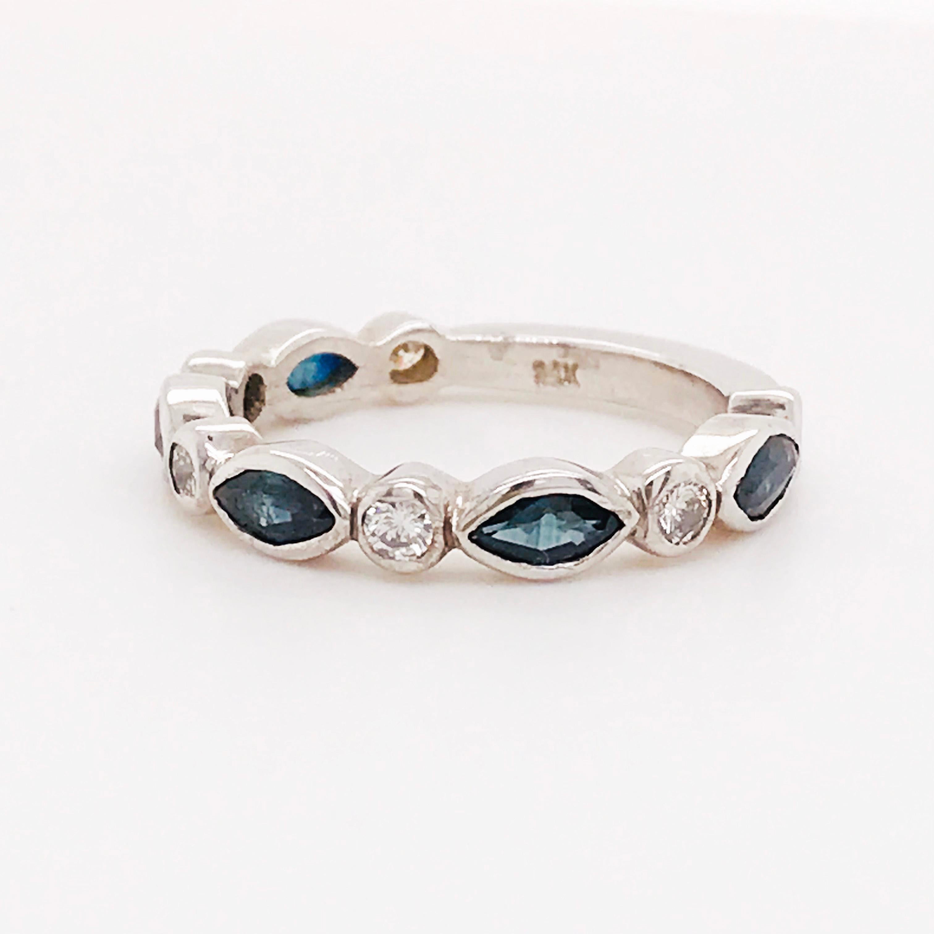 This is a gorgeous ring with five genuine marquise shaped blue sapphire gemstones set East to West. In between round brilliant white diamonds. This band has a unique scalloped design with a fun blue and white pattern. The sapphire gemstones are a