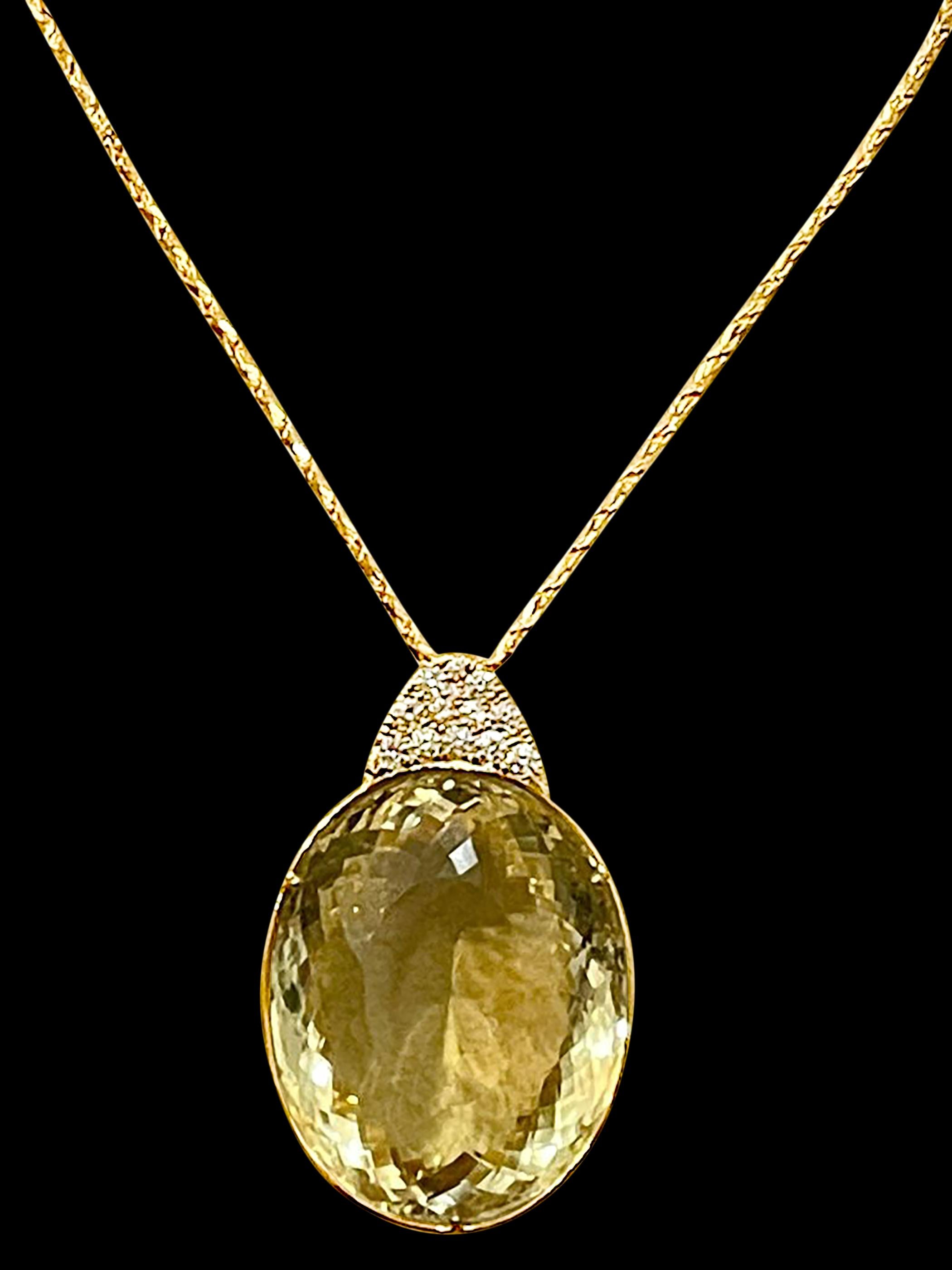Approximately 125 + Carat   Citrine  and approximately 1.0 Ct Diamond Pendent/Necklace 14 Karat  Yellow Gold with Chain
This Huge Oval shape citrine pendant necklace is a eye-catching pendant necklace . It features a large  fine  125  ct  Oval shape