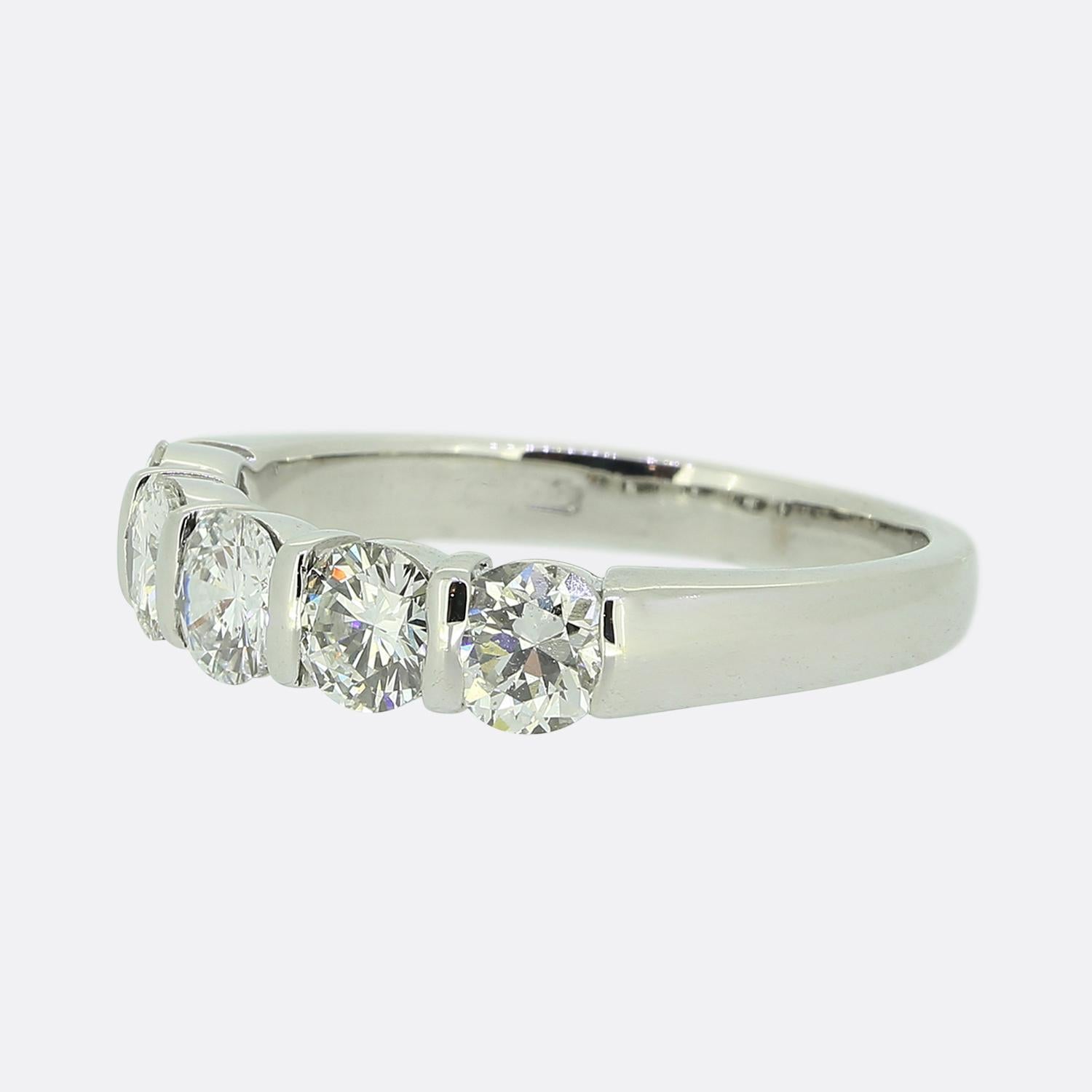 Here we have an 18ct white gold diamond five-stone ring. The five stones are separated by a slim bar setting and each diamond has an excellent sparkle whilst sitting atop a plain polished band.

Condition: Used (Very Good)
Weight: 3.7 grams
Band