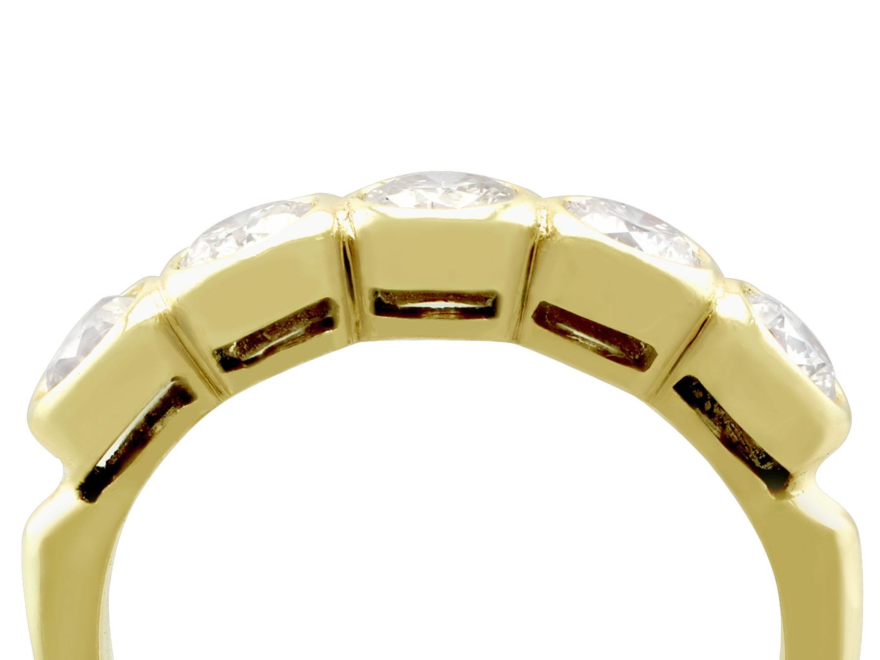 A fine and impressive vintage 1.25 carat, five stone diamond, 14 karat yellow gold ring; part of our vintage jewelry and estate jewelry collections.

This ladies vintage diamond cocktail ring has been crafted in 14k yellow gold.

The ring displays