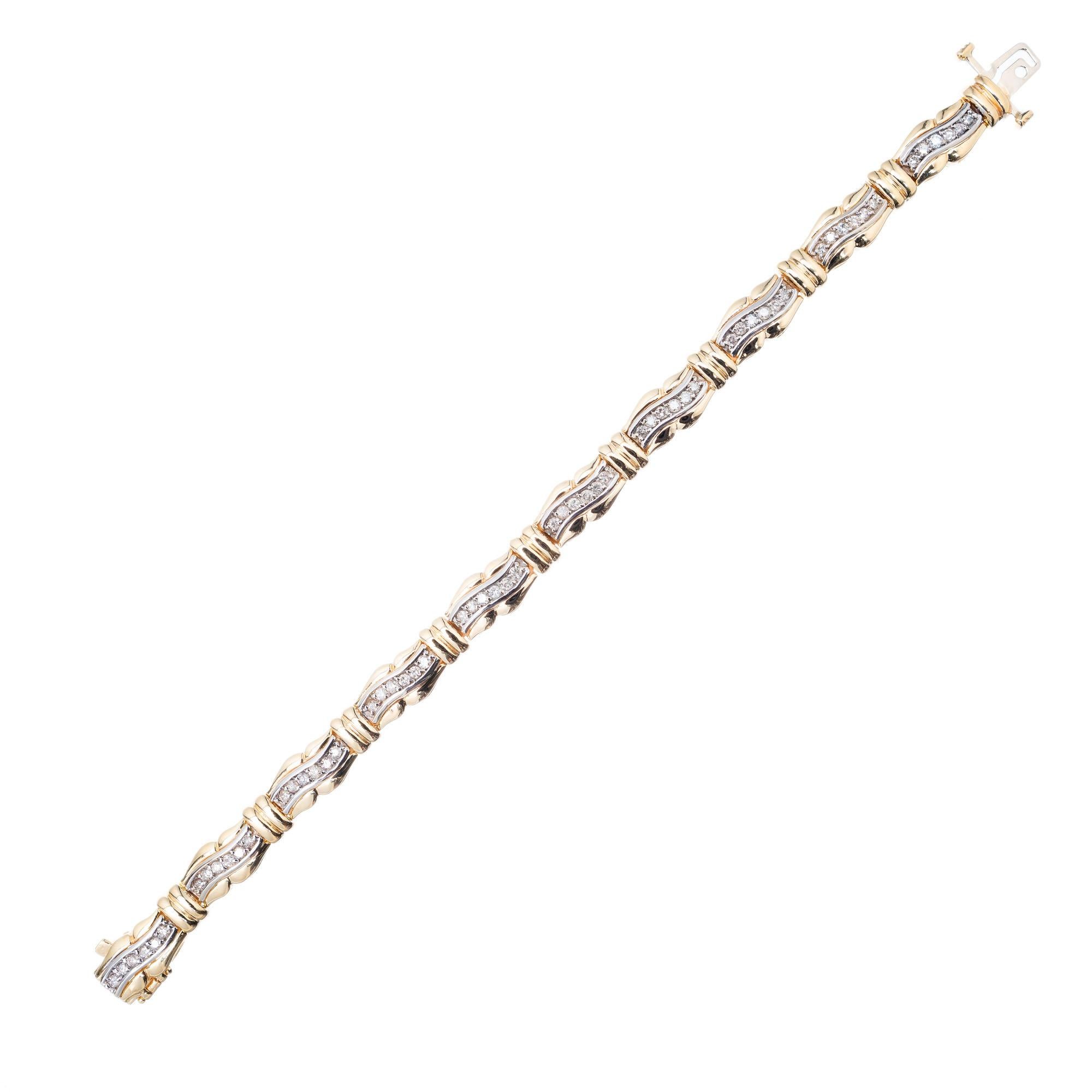 Diamond swirl link bracelet. 60 full cut diamonds set in 14k yellow gold links with white gold diamond sections bead set with bright full cut diamonds. Built in catch and underside safety.  6.75 length. 

60 full cut diamonds approx. total weight