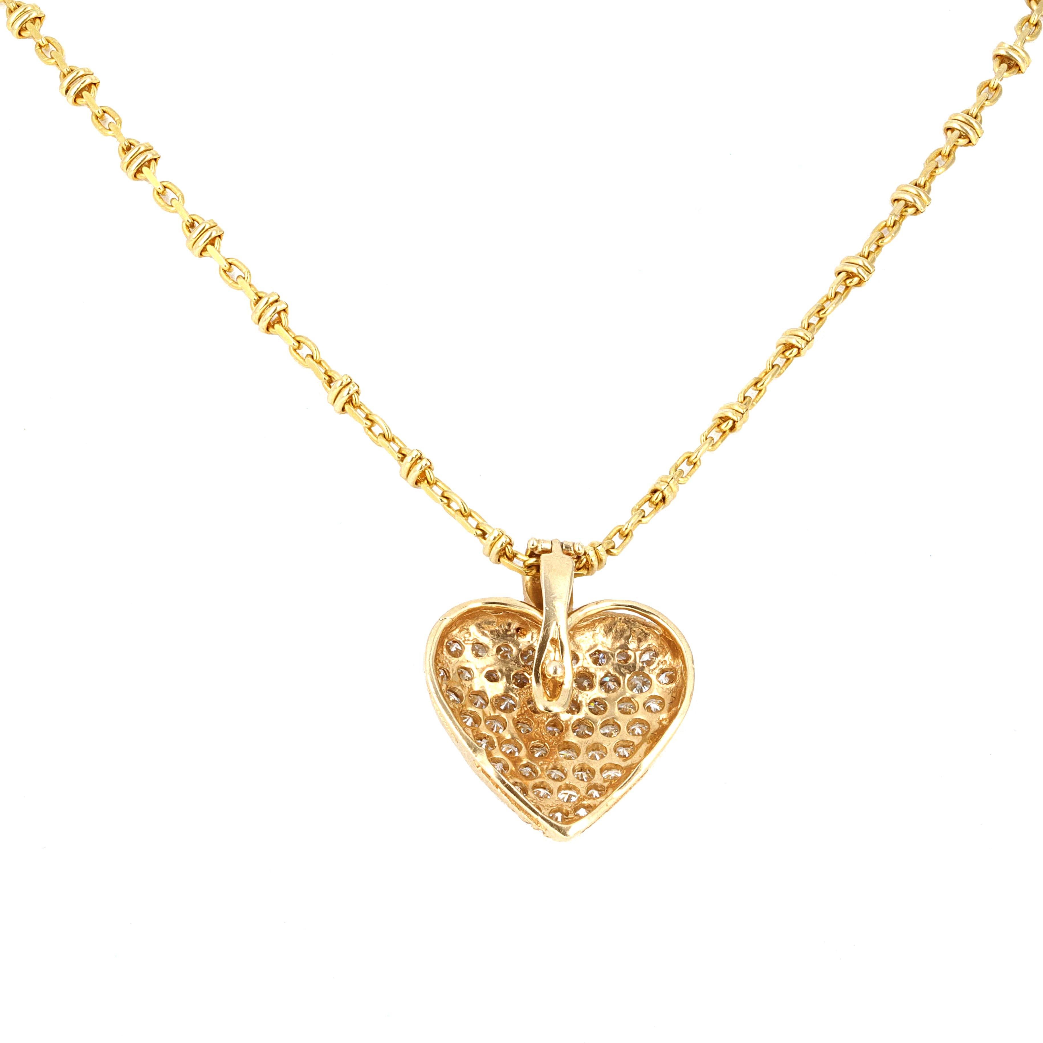 14 karat yellow gold pave diamond heart pendant on an 18 inch chain. The heart has 1.25 carats total weigh of white round brilliant diamonds. The pendant is detachable.
