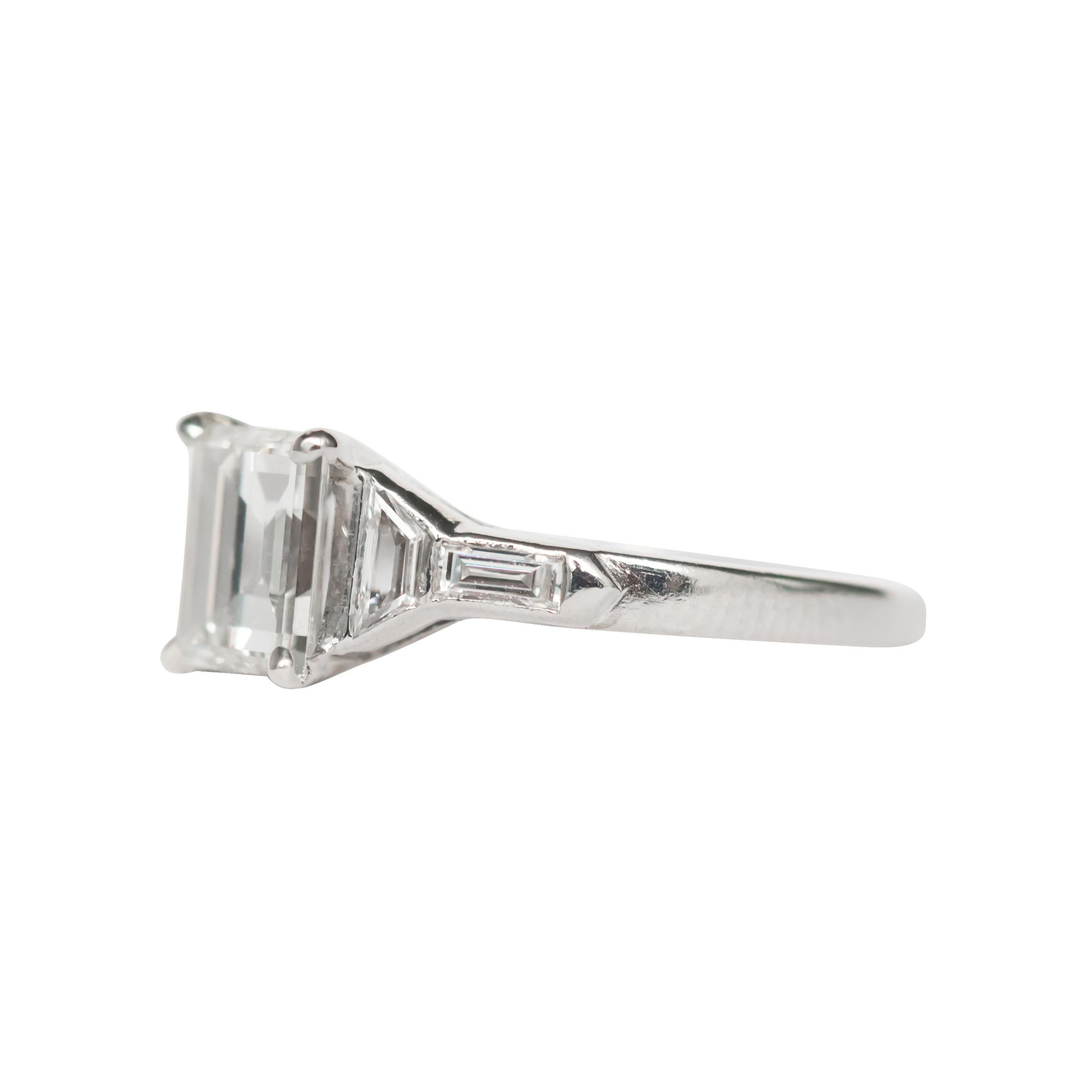 Ring Size: 7.25
Metal Type: Platinum [Hallmarked, and Tested]
Weight:  3.8 grams

Center Diamond Details:
Weight: 1.25 carat 
Cut: Carre Cut
Color: I
Clarity: SI2

Side Diamond Details:  
Shape: Straight Baguette and Hexagonal Step Cut 
Carat: .50