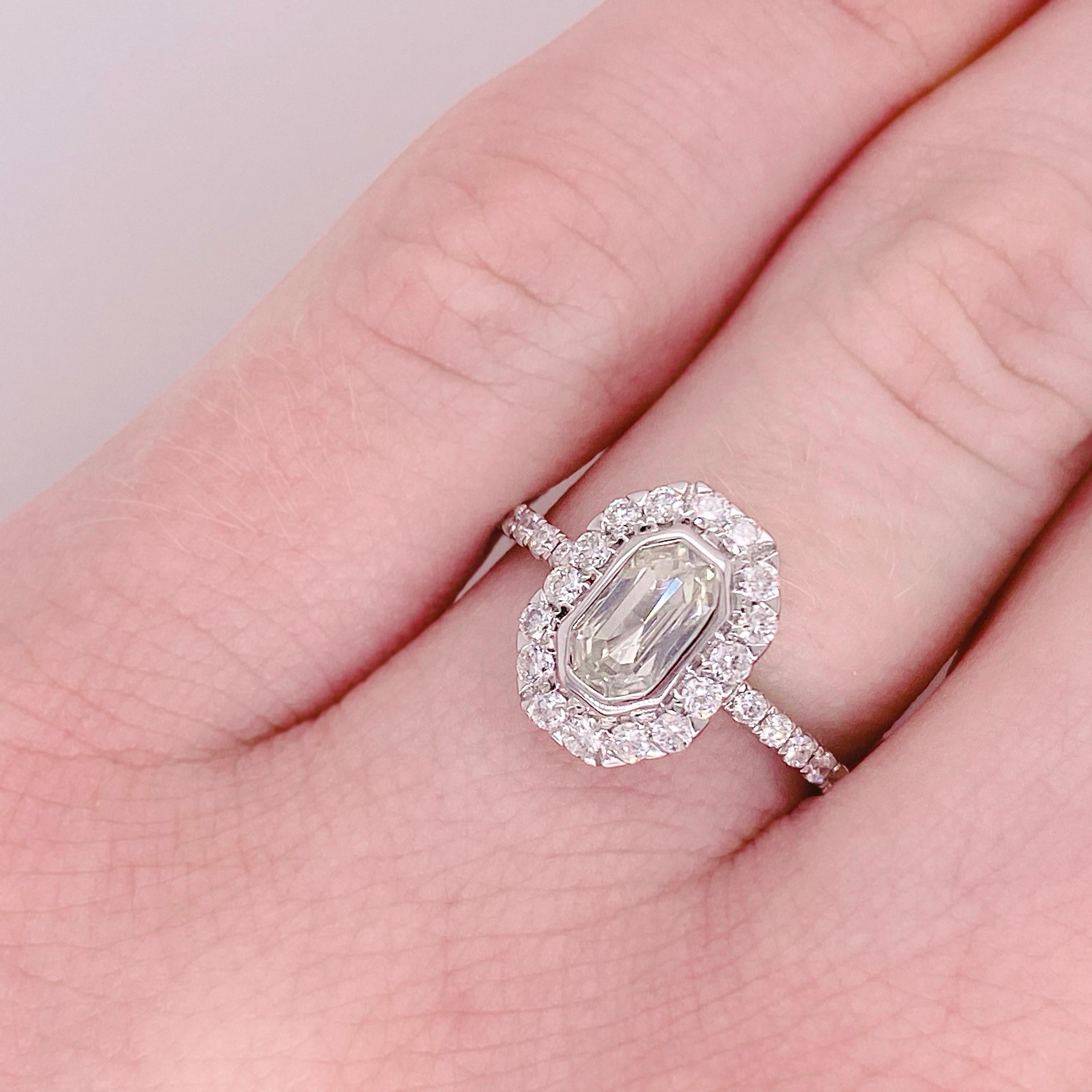 Vintage Inspired Emerald cut Diamond Engagement ring with Brilliant Diamond Halo

 This is a beautiful french cut engagement ring, its dainty design has the power of making any wearer feel beautiful, one of a kind, and decadent! With a .73 carat